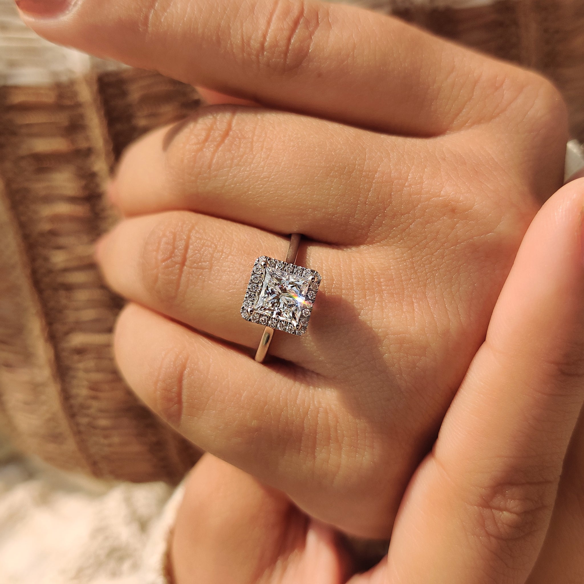 Princess cut diamond ring with round cut halo
