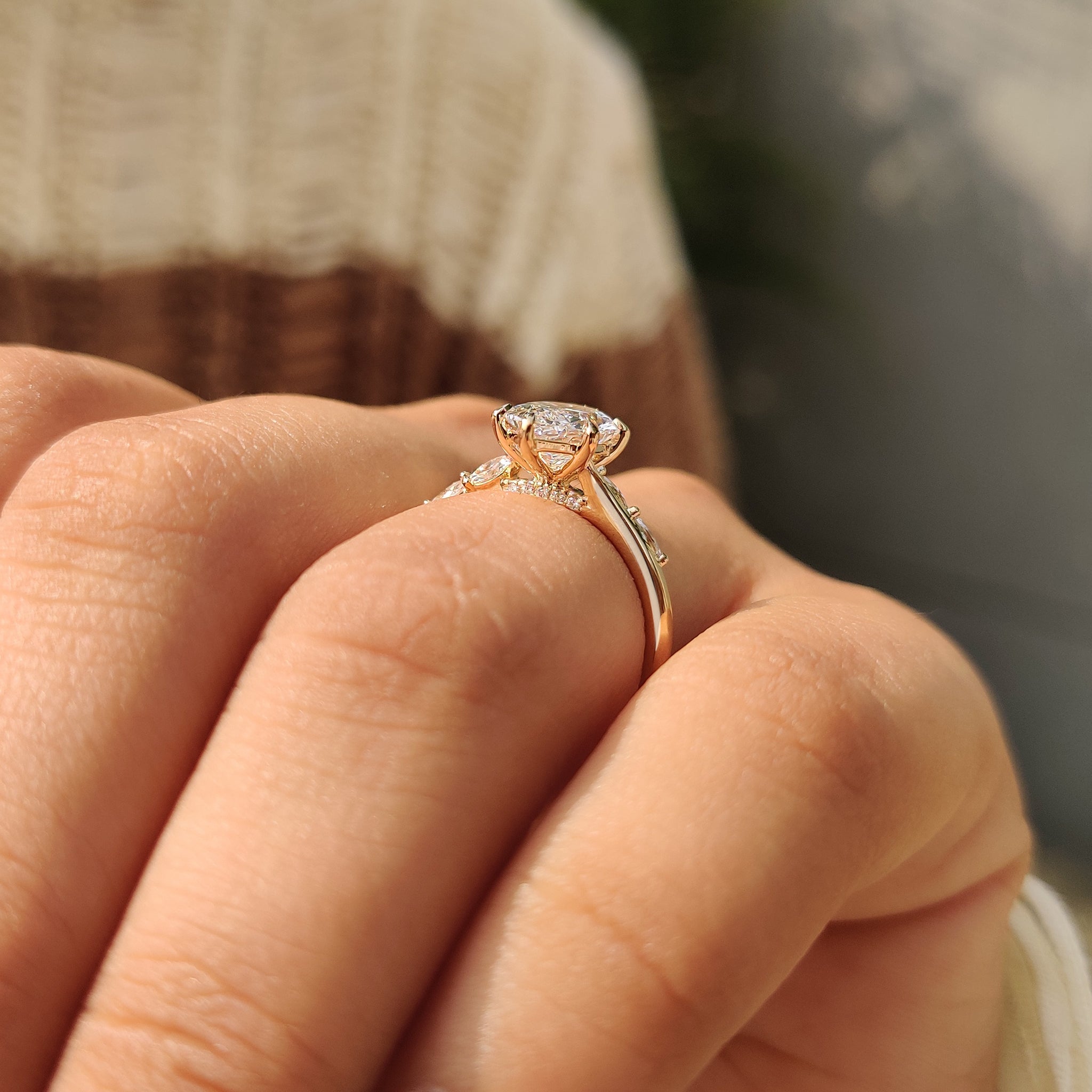 Round cut side stone ring with a smooth handmade design.
