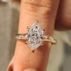 Marquise diamond engagement ring crafted in yellow gold.
