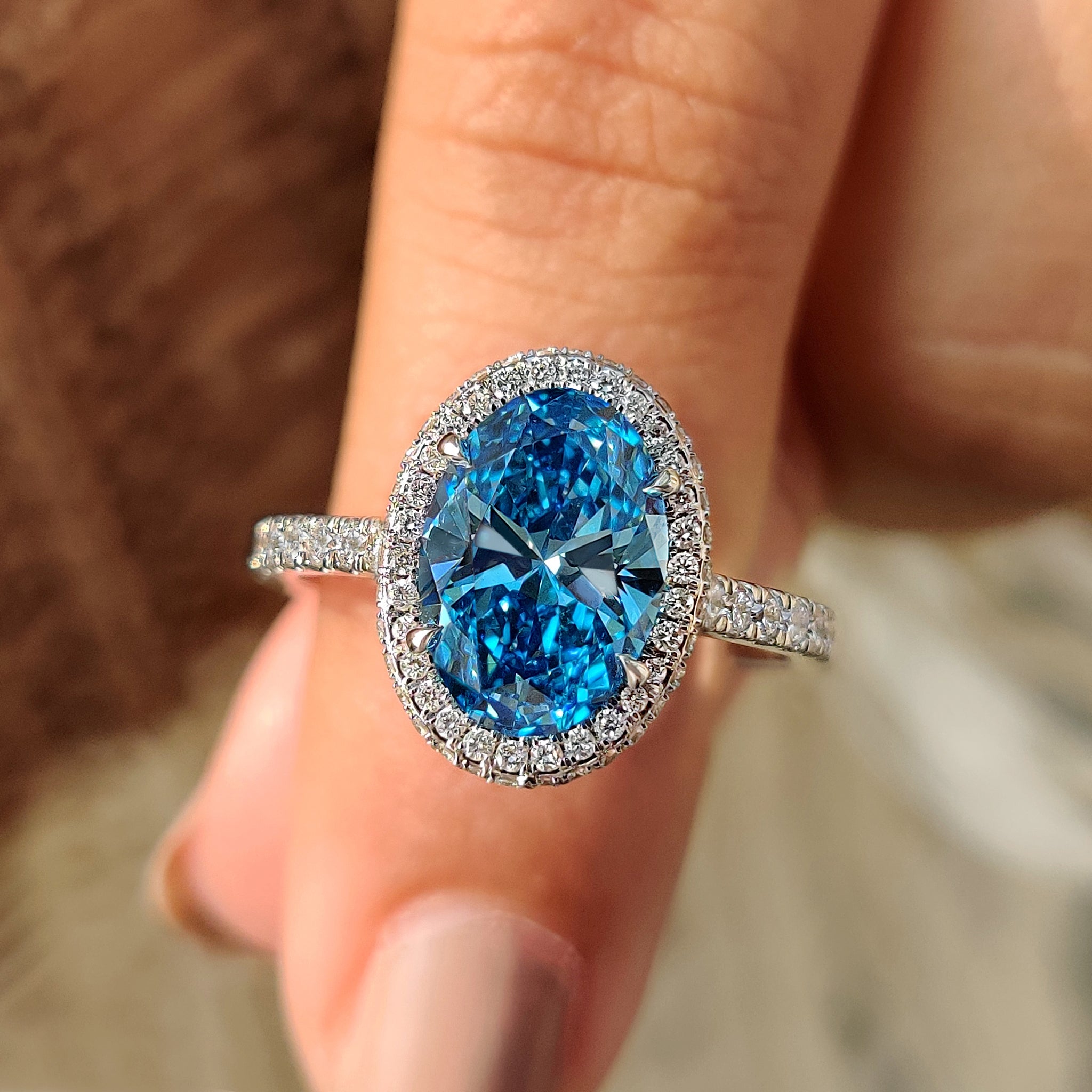 Blue Oval Diamond Engagement Ring in white gold
