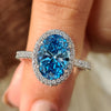 Blue Oval Diamond Engagement Ring in white gold
