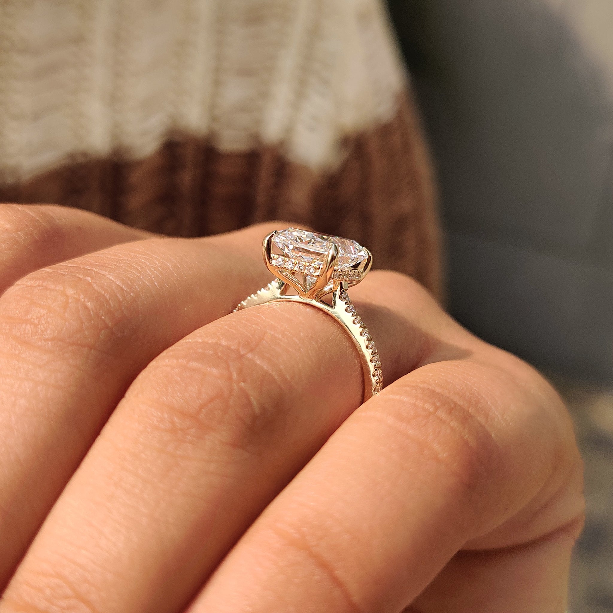 Radiant halo ring with round cut pave band
