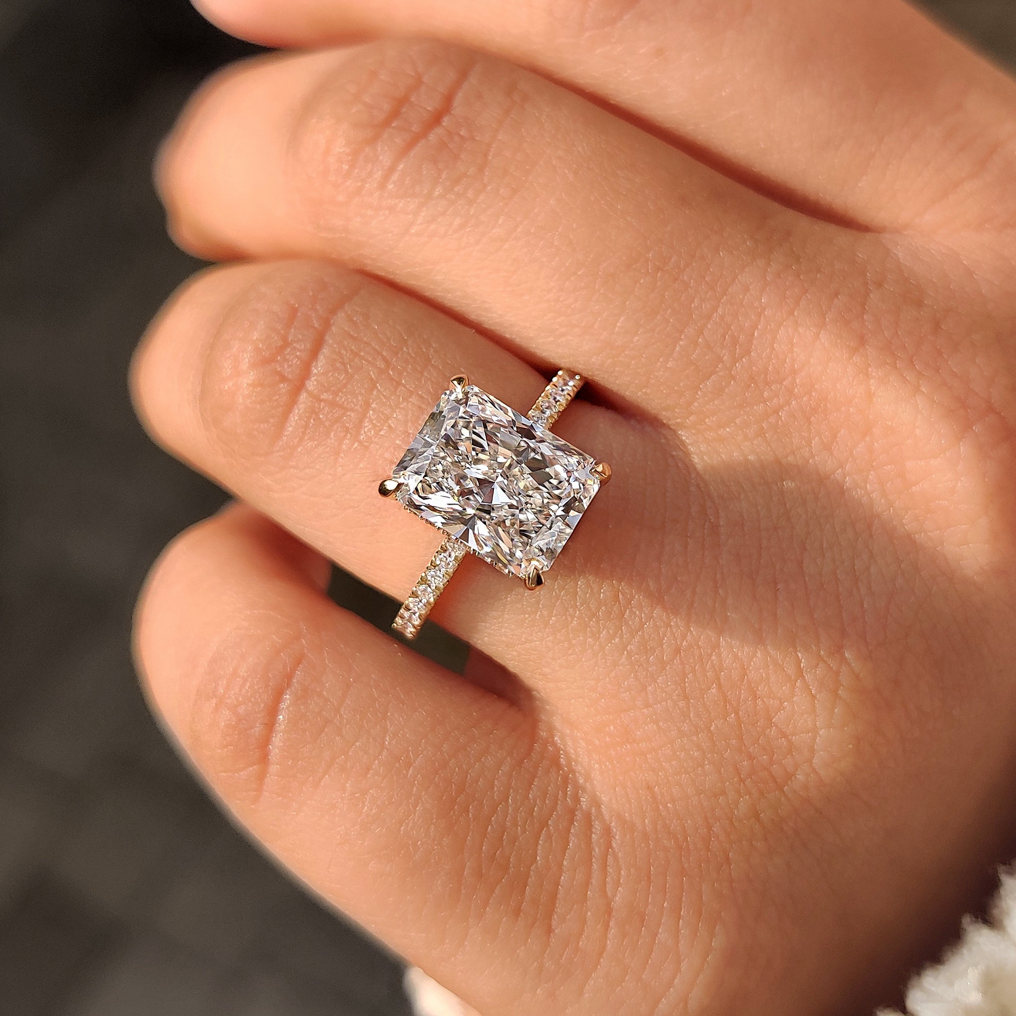 Radiant centre stone ring with hidden halo
