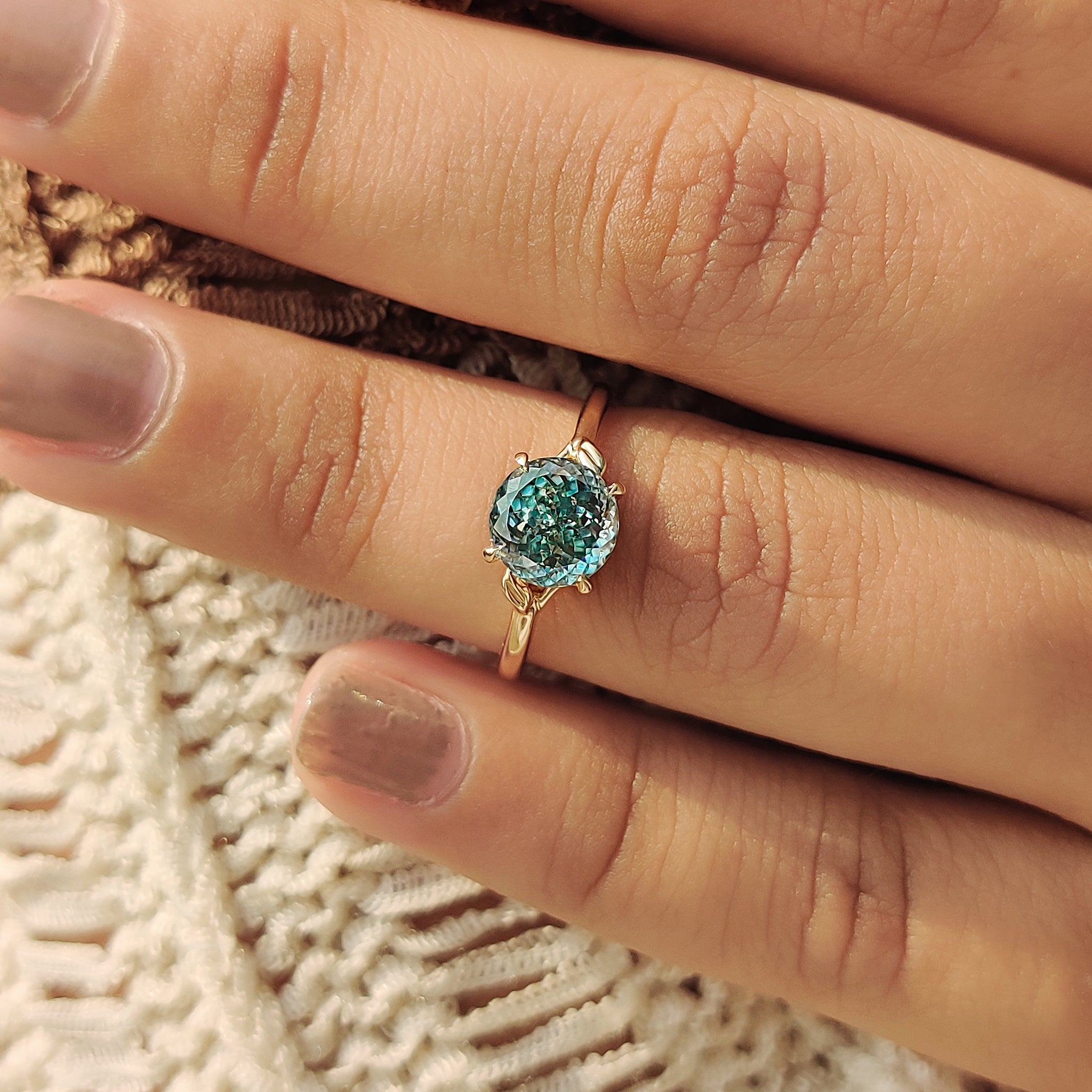 Yellow gold custom engagement ring with Portuguese cut stone
