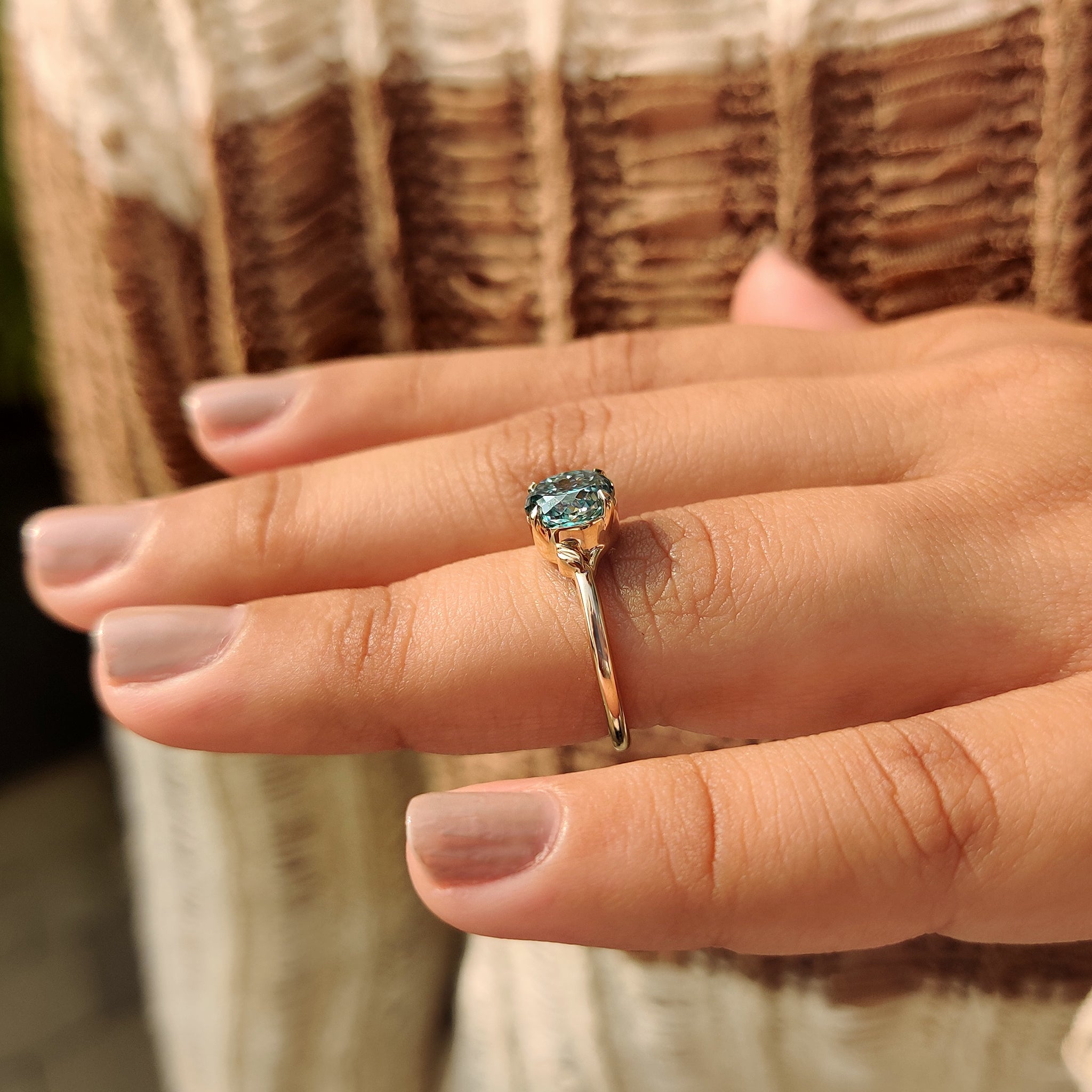 Solitaire moissanite ring in Portuguese cut and cyan blue shade
