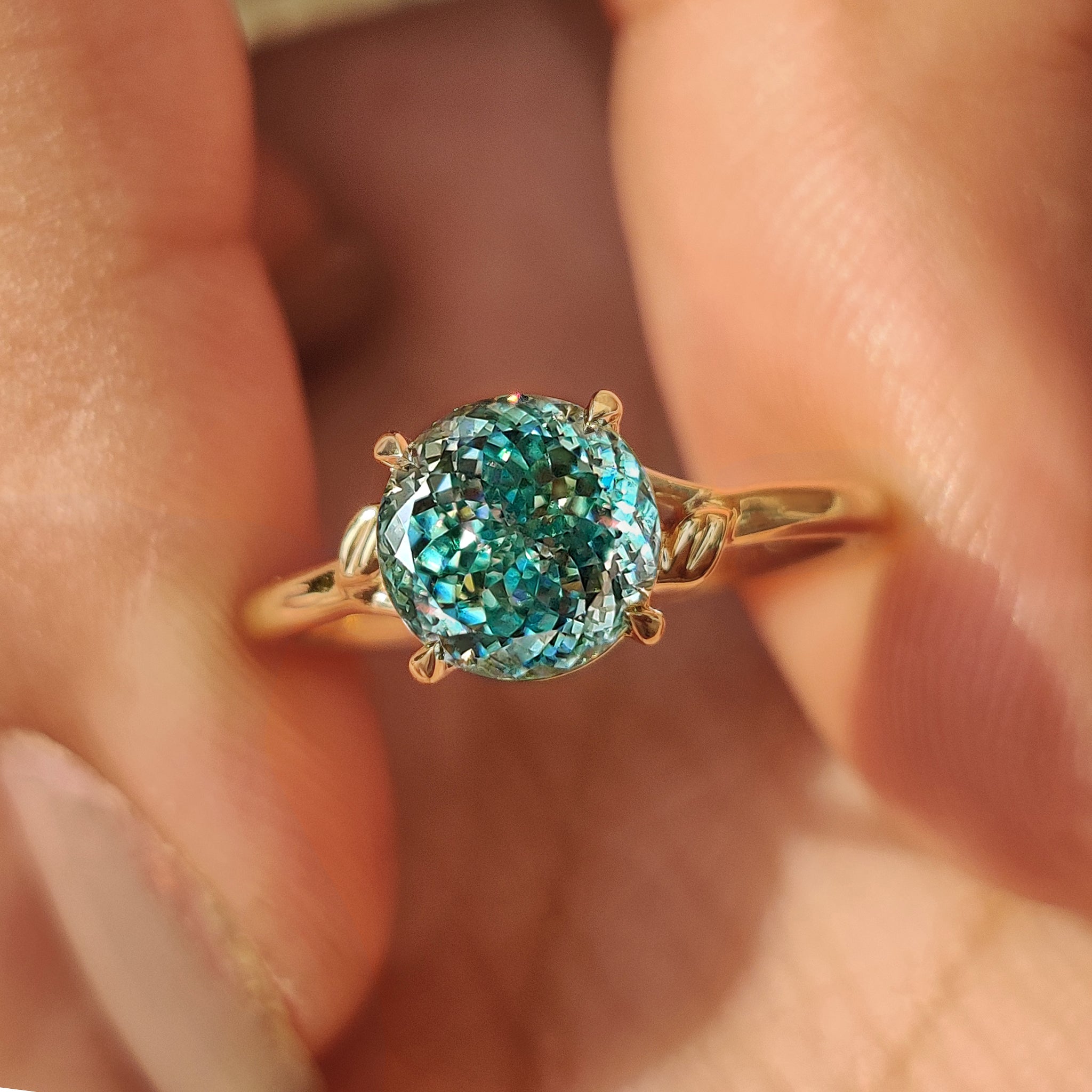 Custom yellow gold solitaire ring with Portuguese cut moissanite
