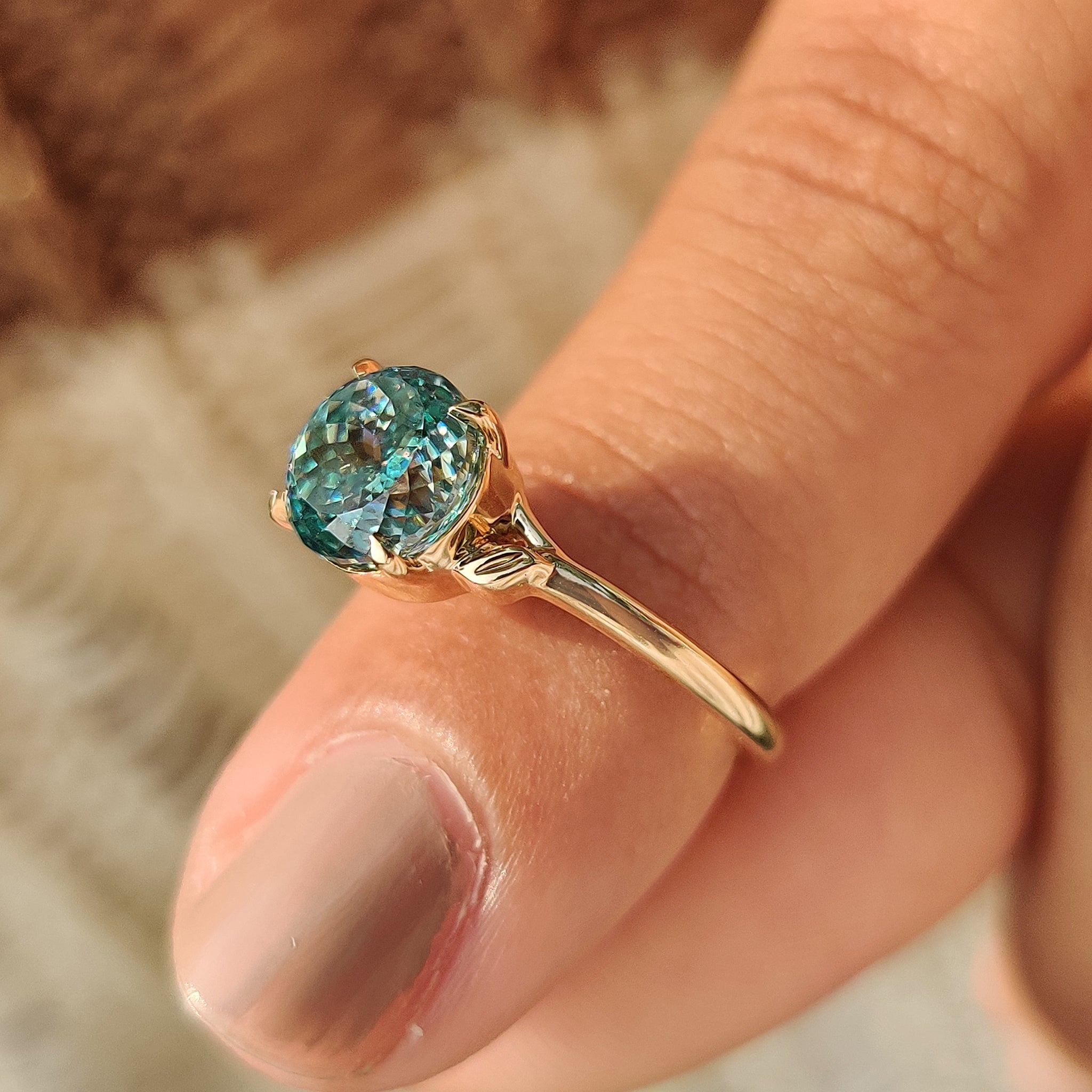 Carat Diamonds cyan blue Portuguese cut engagement ring
