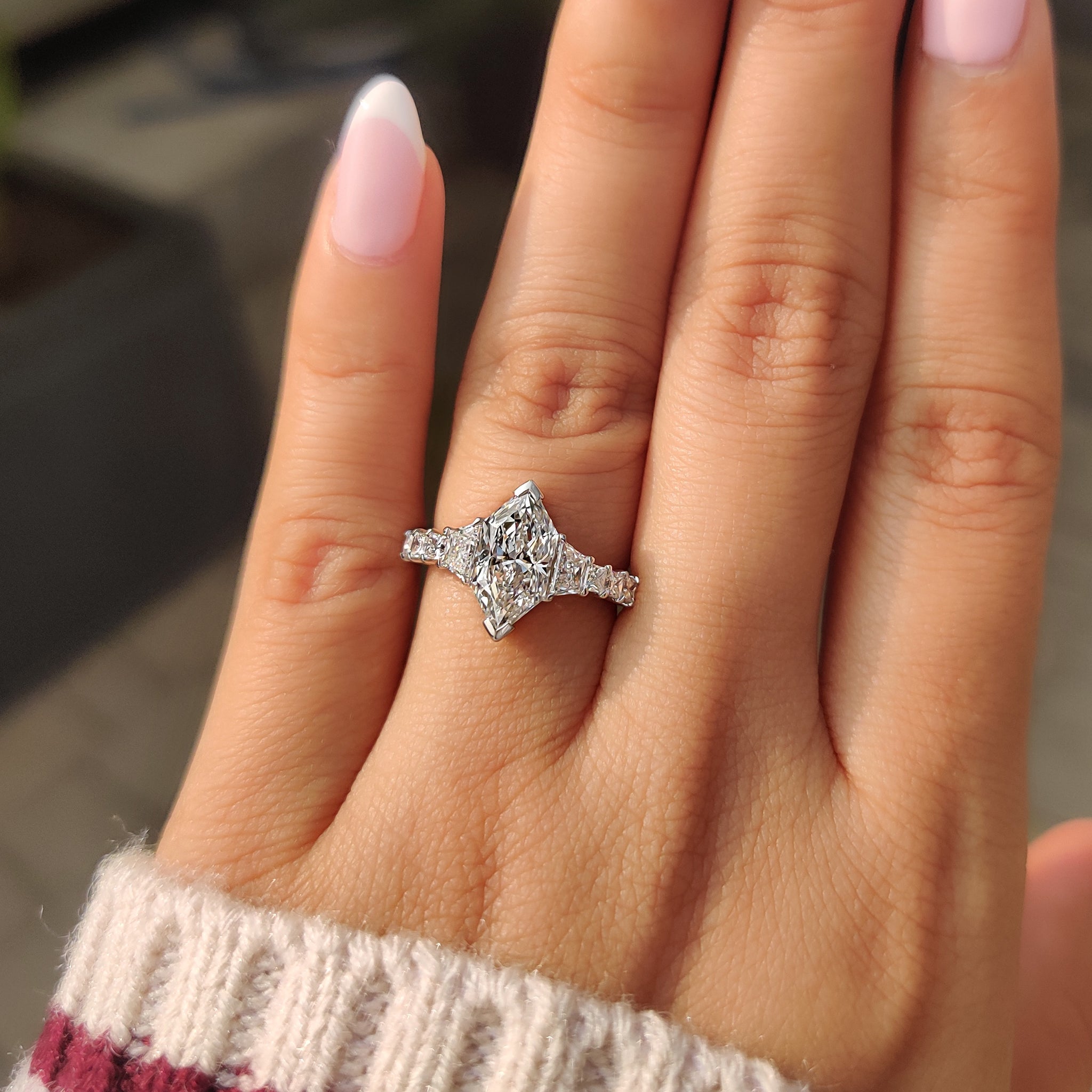 Carat Diamonds engagement ring with white gold tapered shank.
