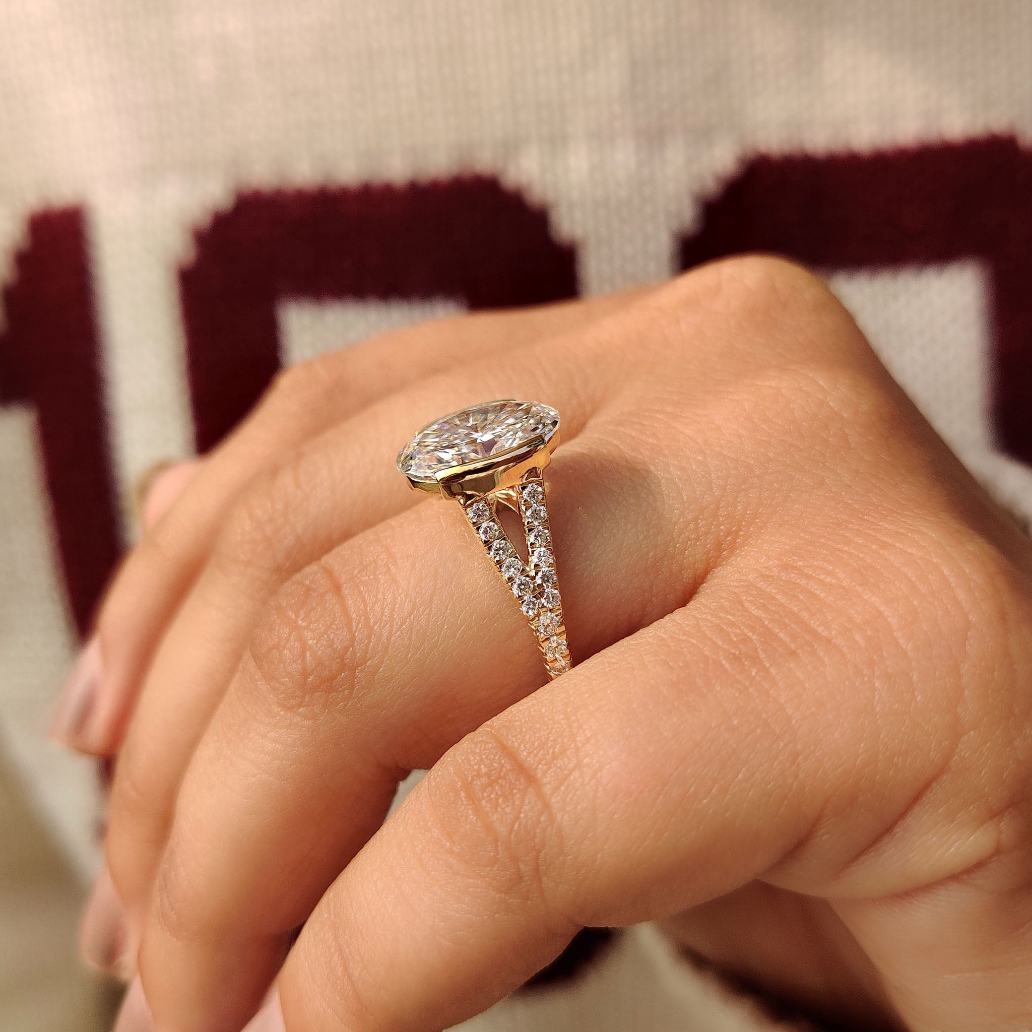 Oval diamond ring with cathedral setting and bridge accent
