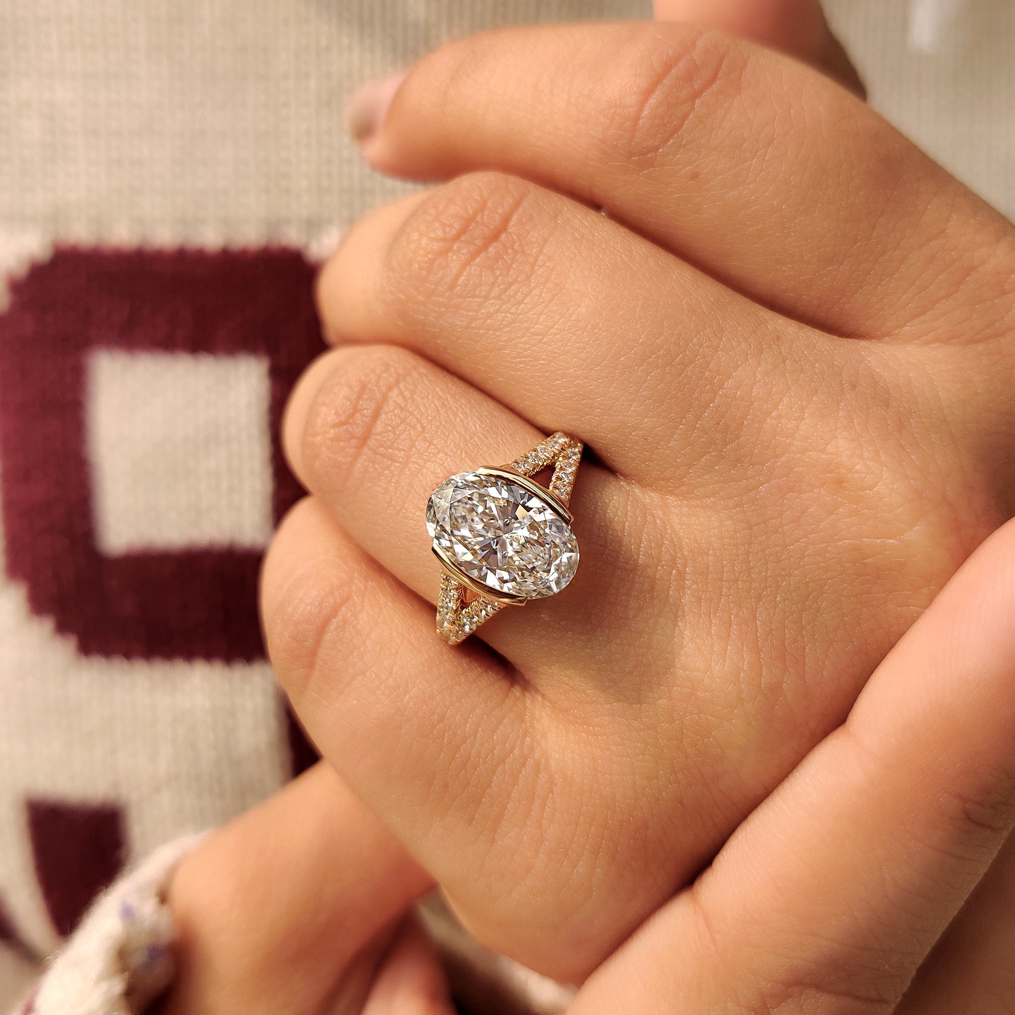 Lab grown oval and round cut diamond engagement ring
