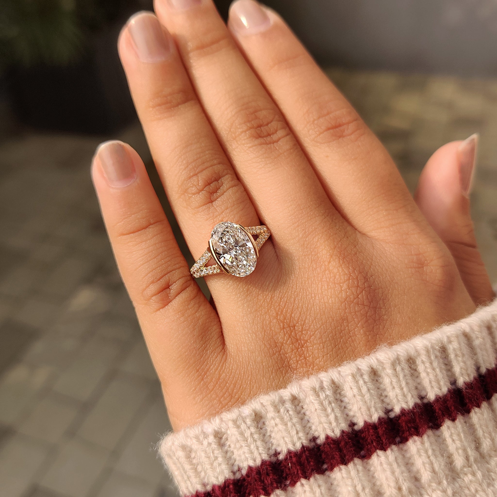 Carat Diamonds oval half bezel engagement ring