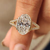 Yellow gold oval diamond ring with half bezel setting
