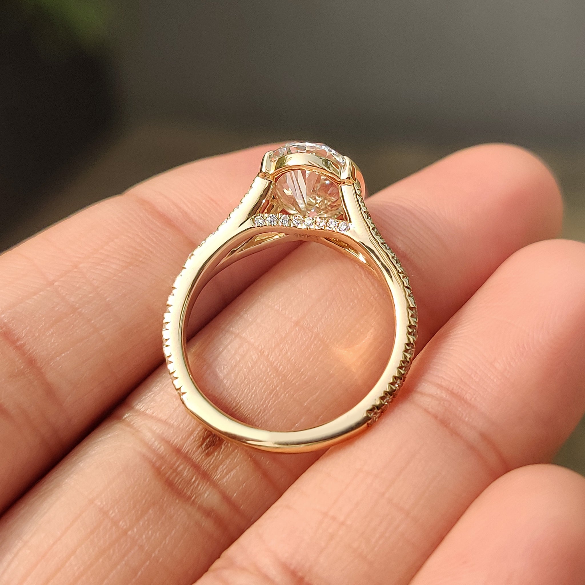 Custom oval diamond ring in yellow gold
