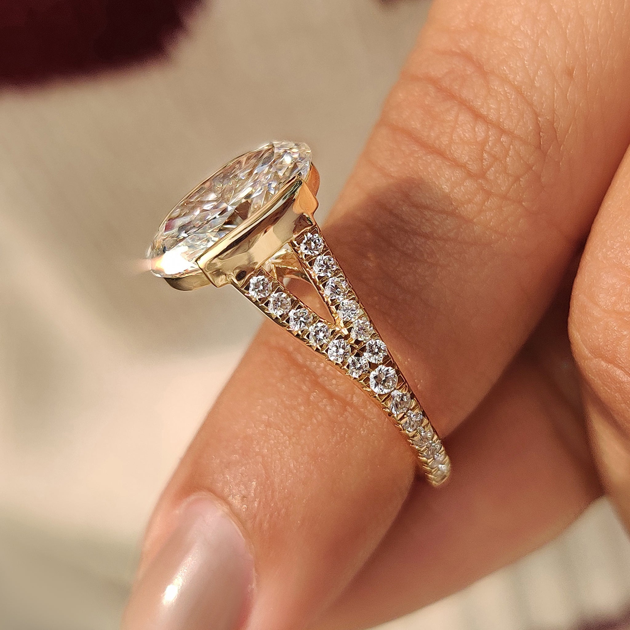 Split shank oval diamond ring with bridge accent
