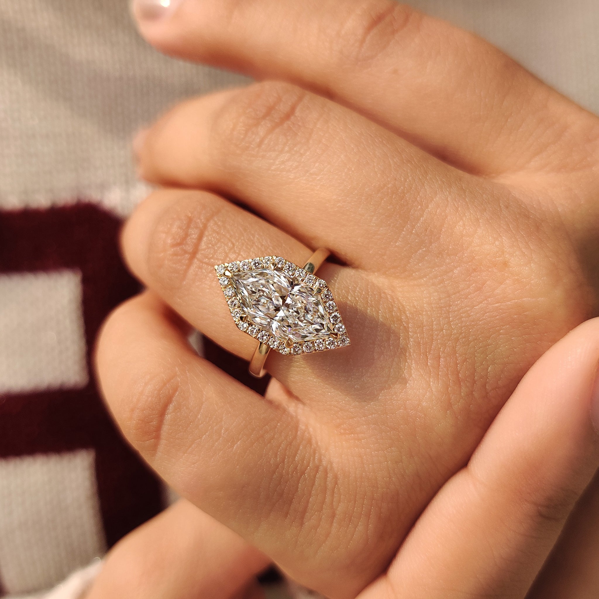 Lab grown marquise diamond ring with round halo
