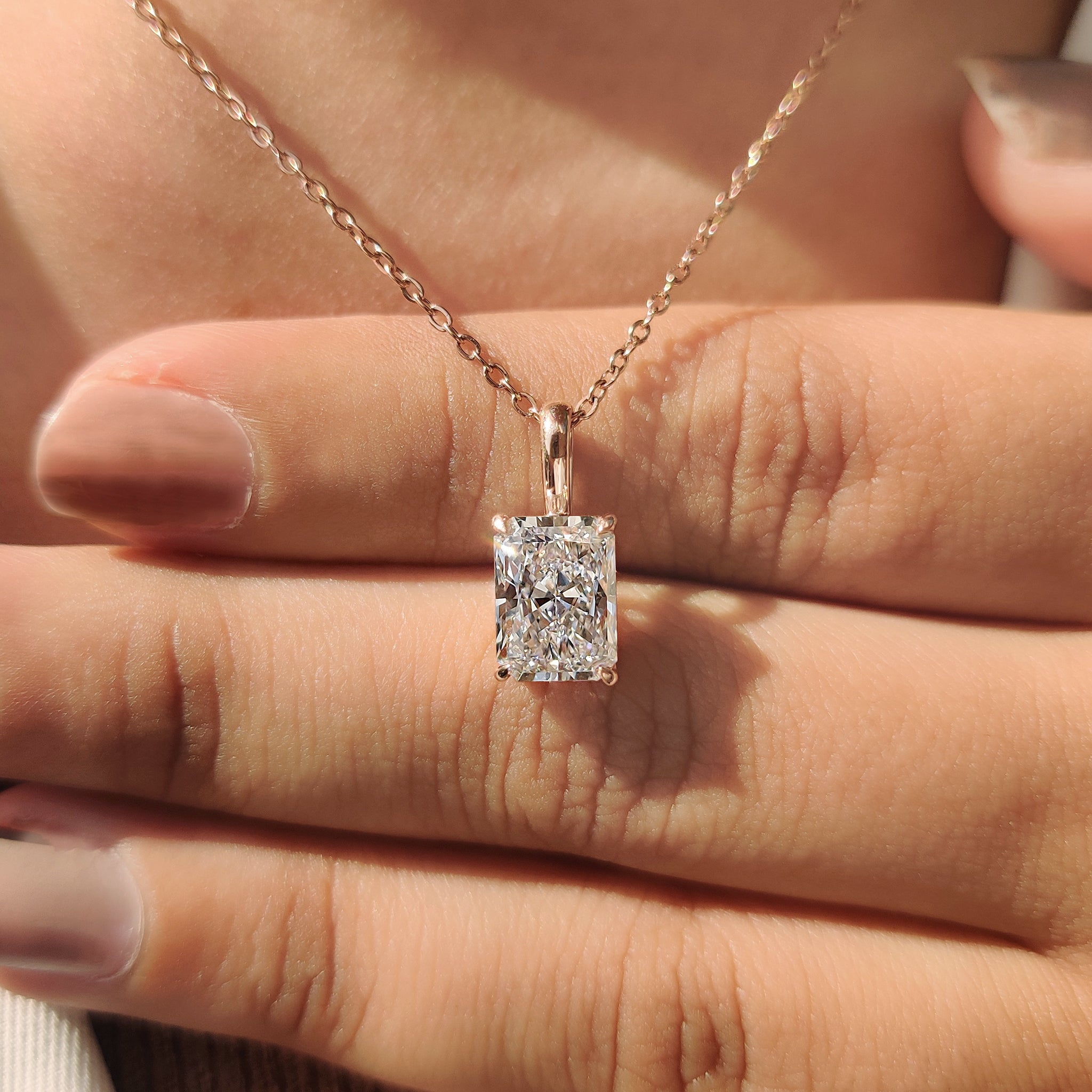 Rose gold pendant featuring unique diamond pendant.
