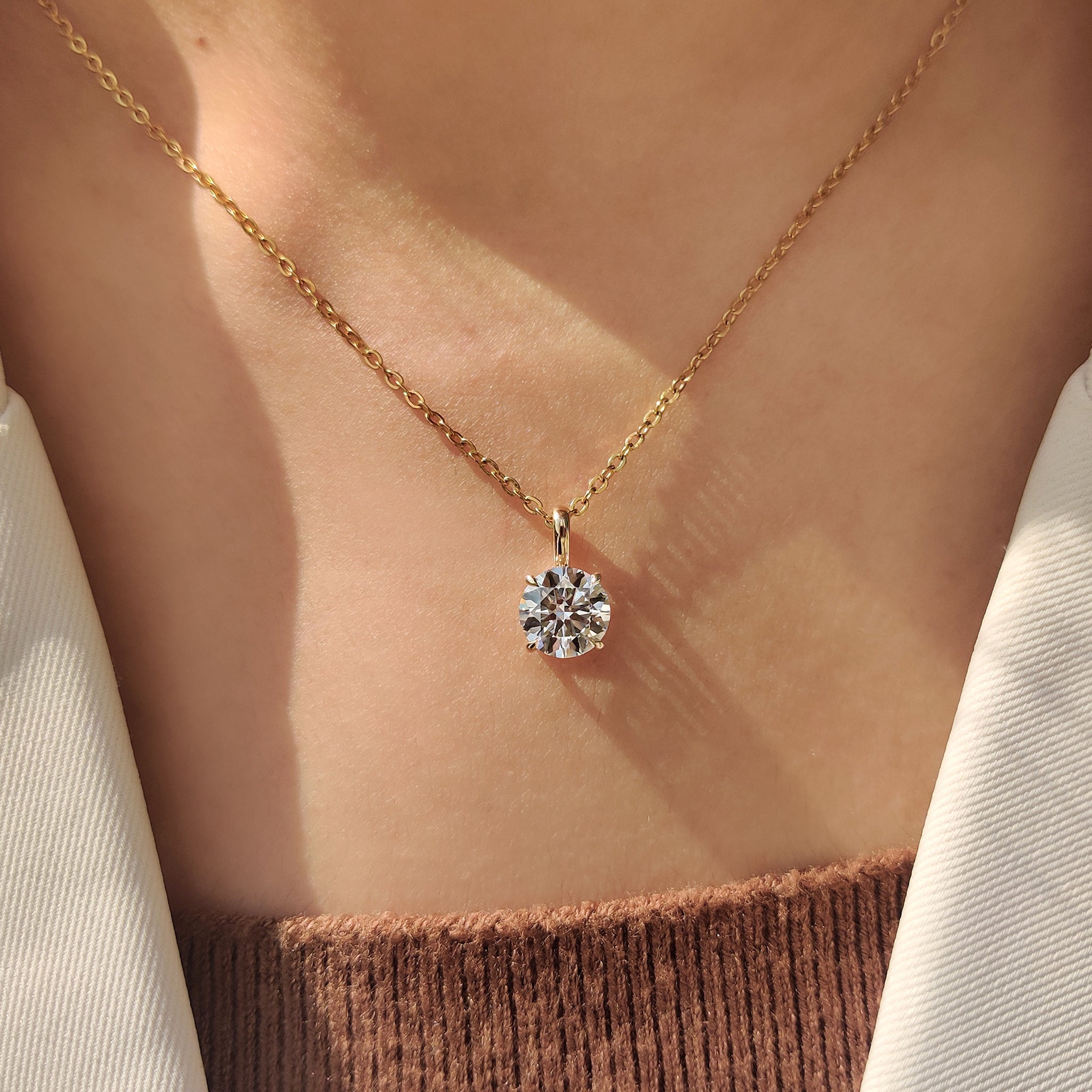 Round cut solitaire pendant with handmade jewelry.
