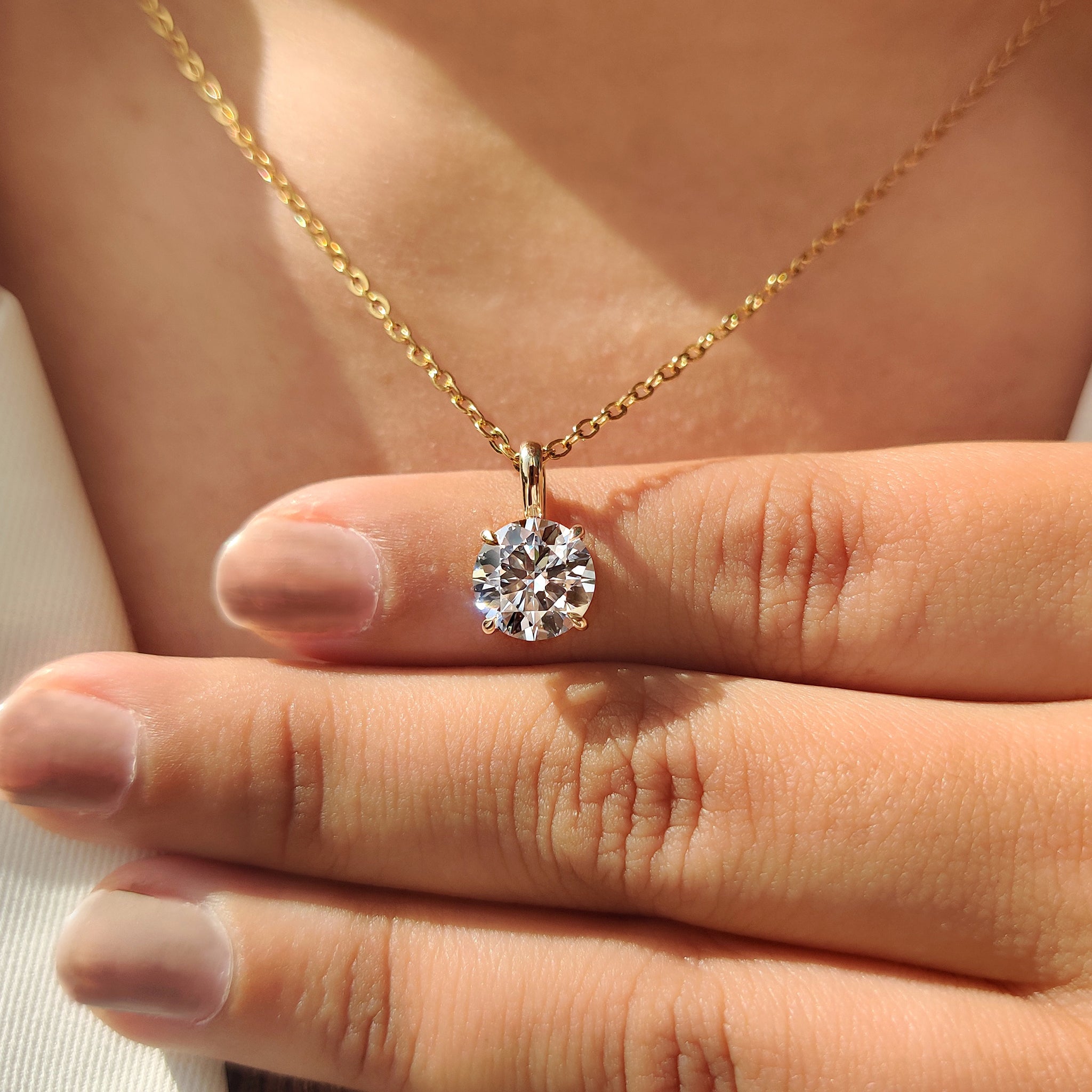 Handmade jewelry with Carat Diamonds pendant.
