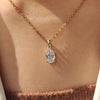 Oval diamond pendant with diamond solitaire pendant.
