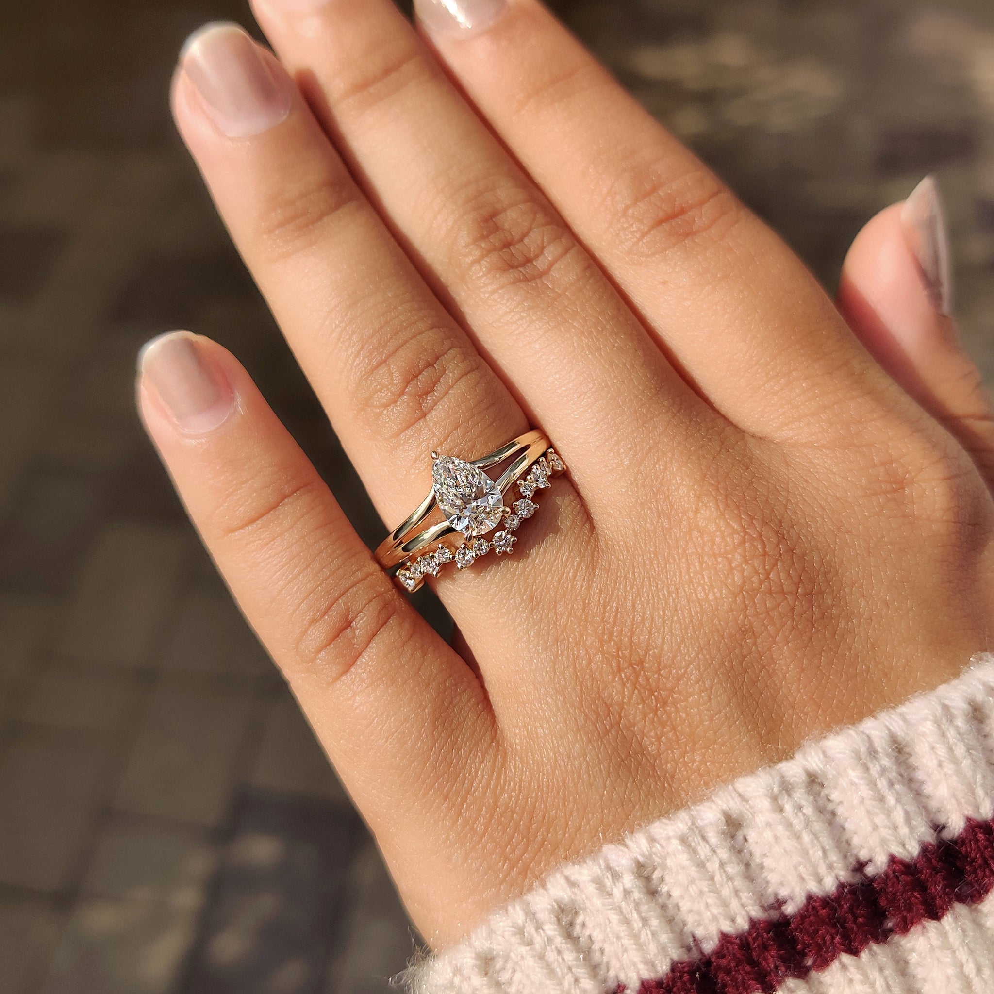 Pear shaped bridal set in hidden halo engagement ring.
