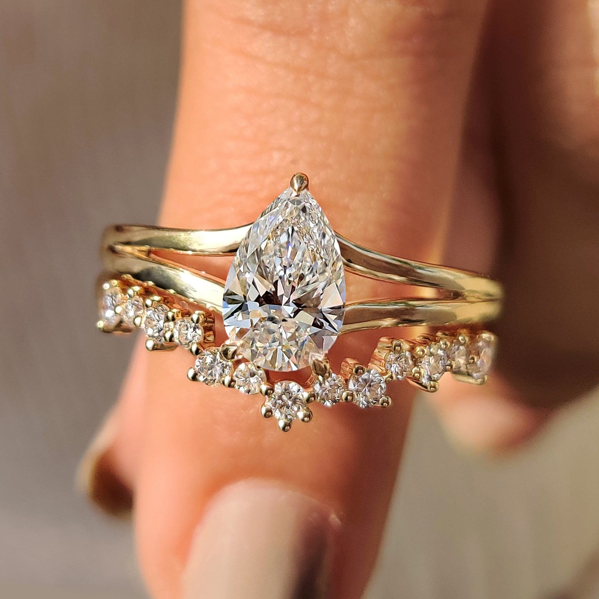 Pear shaped ring with band in pear shaped bridal set.
