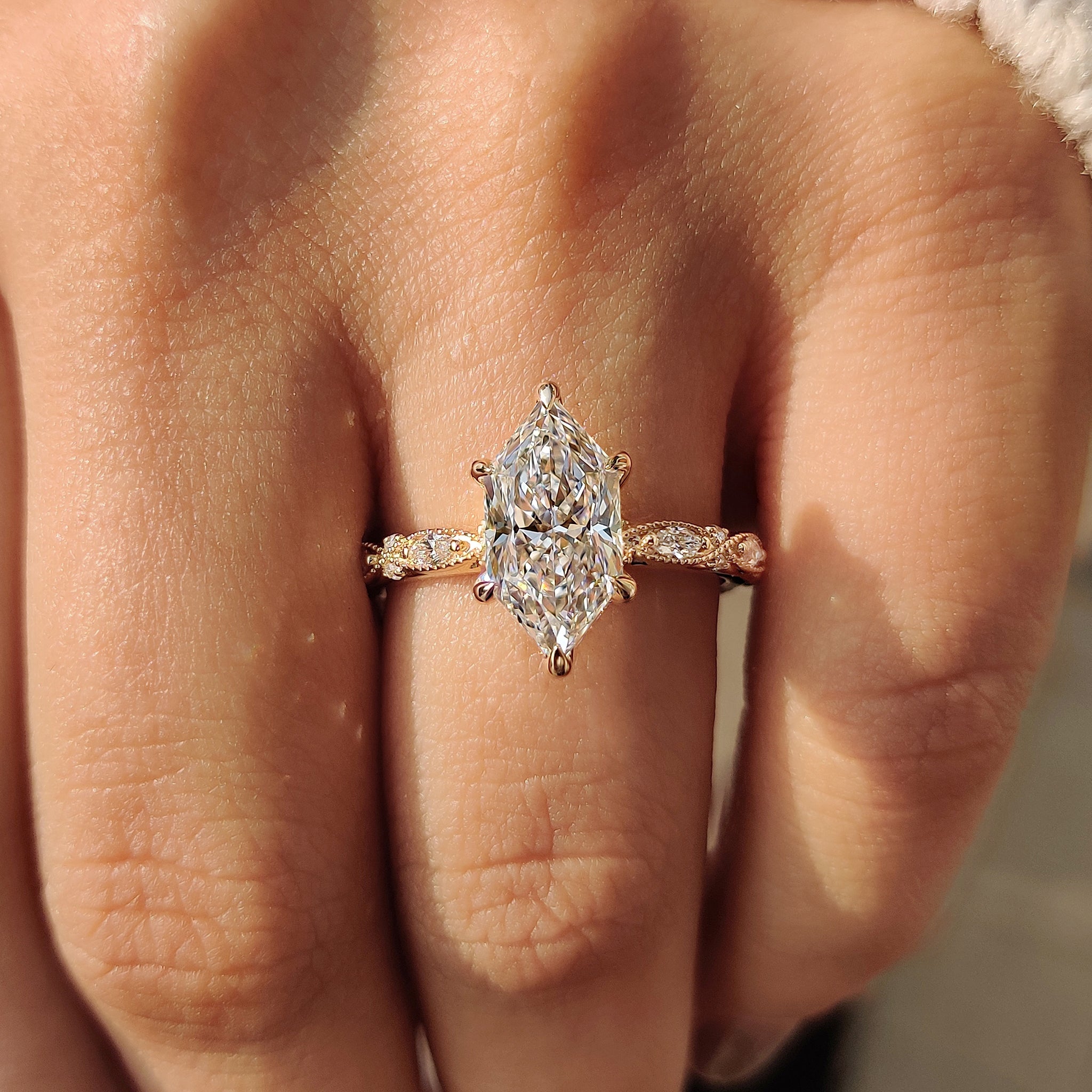 Yellow gold ring with a marquise center stone.
