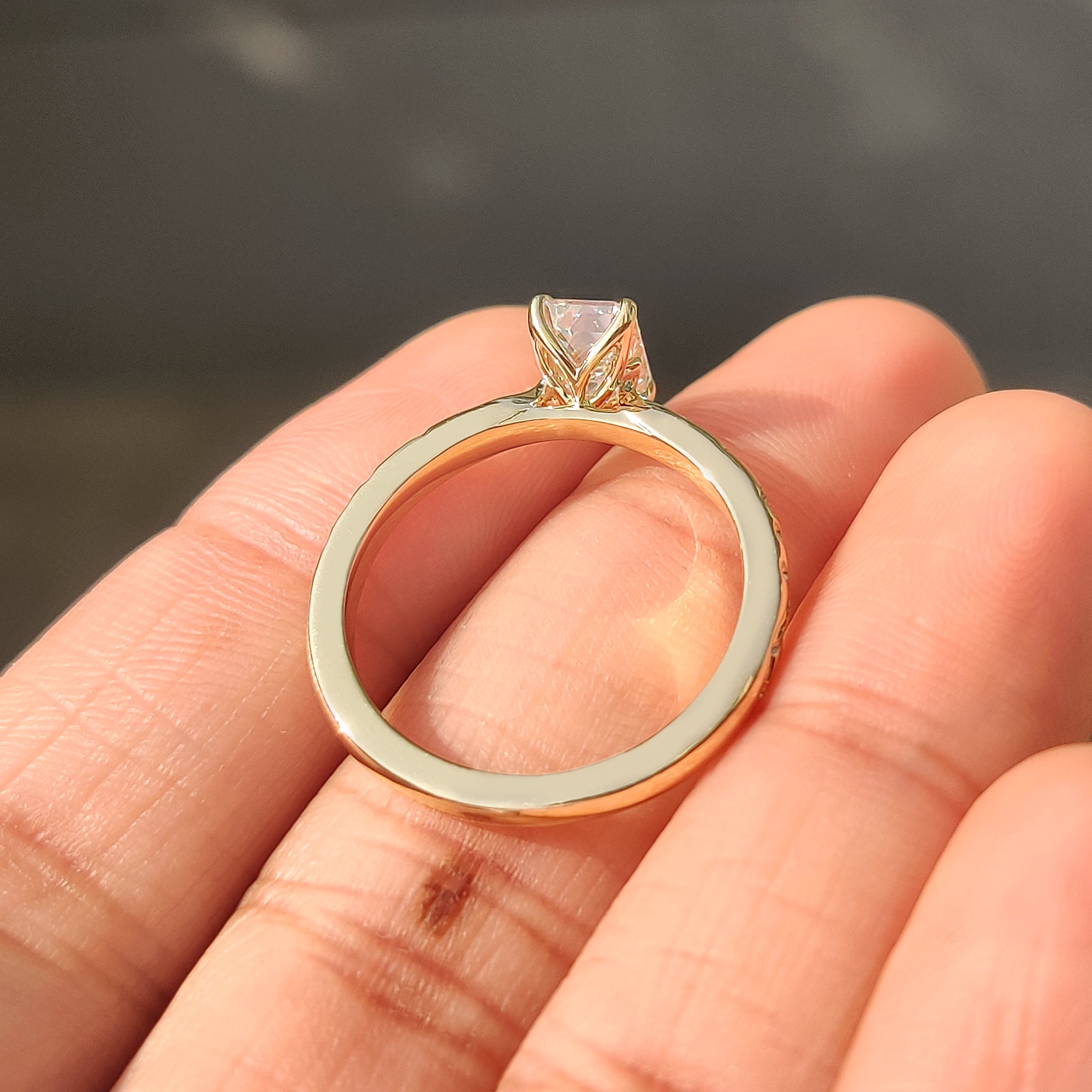 Vintage emerald cut ring with round side stones.
