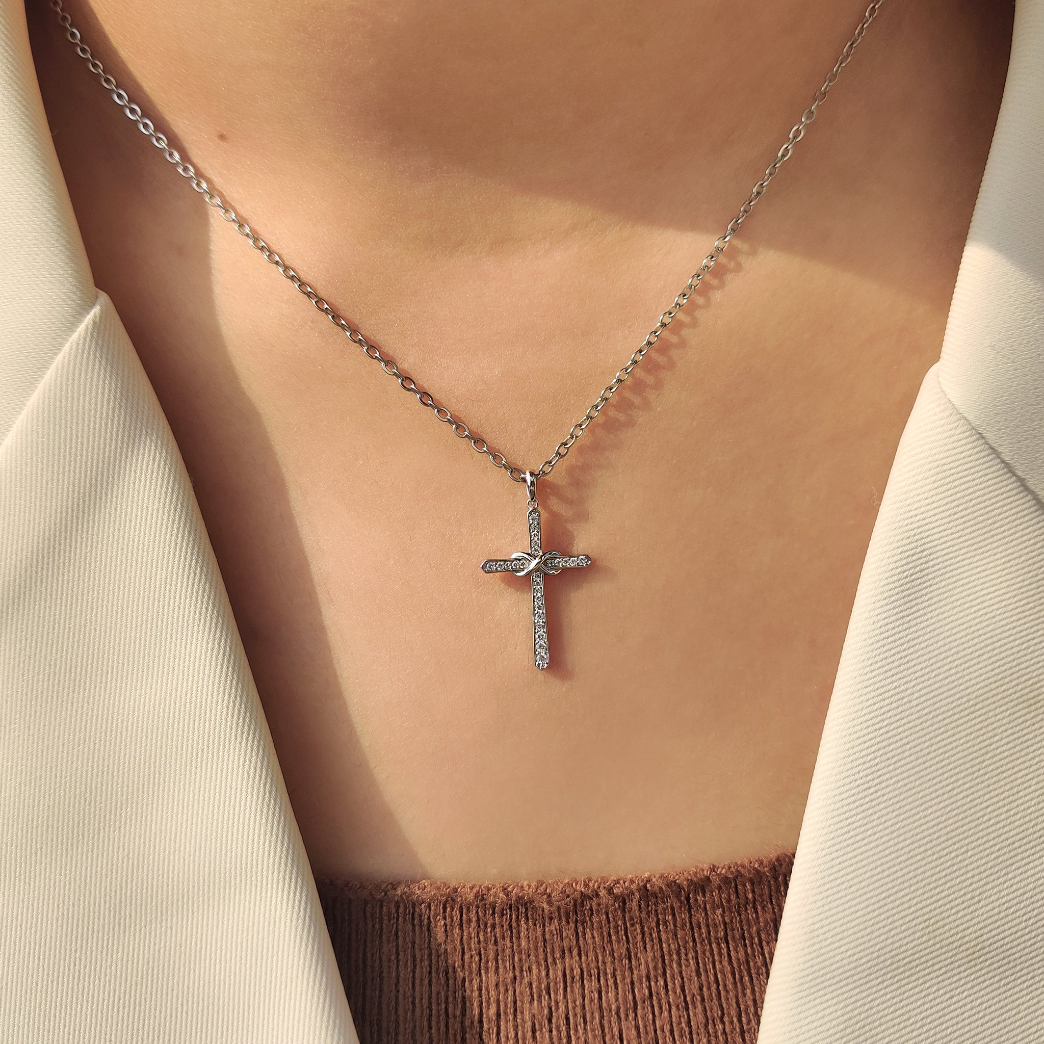 Infinity cross pendant with lab grown diamonds.
