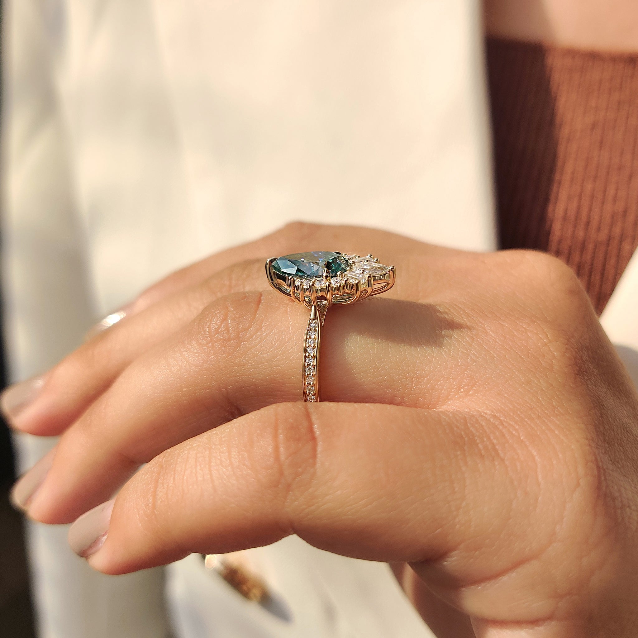 Tapered baguette engagement ring in a cluster style.
