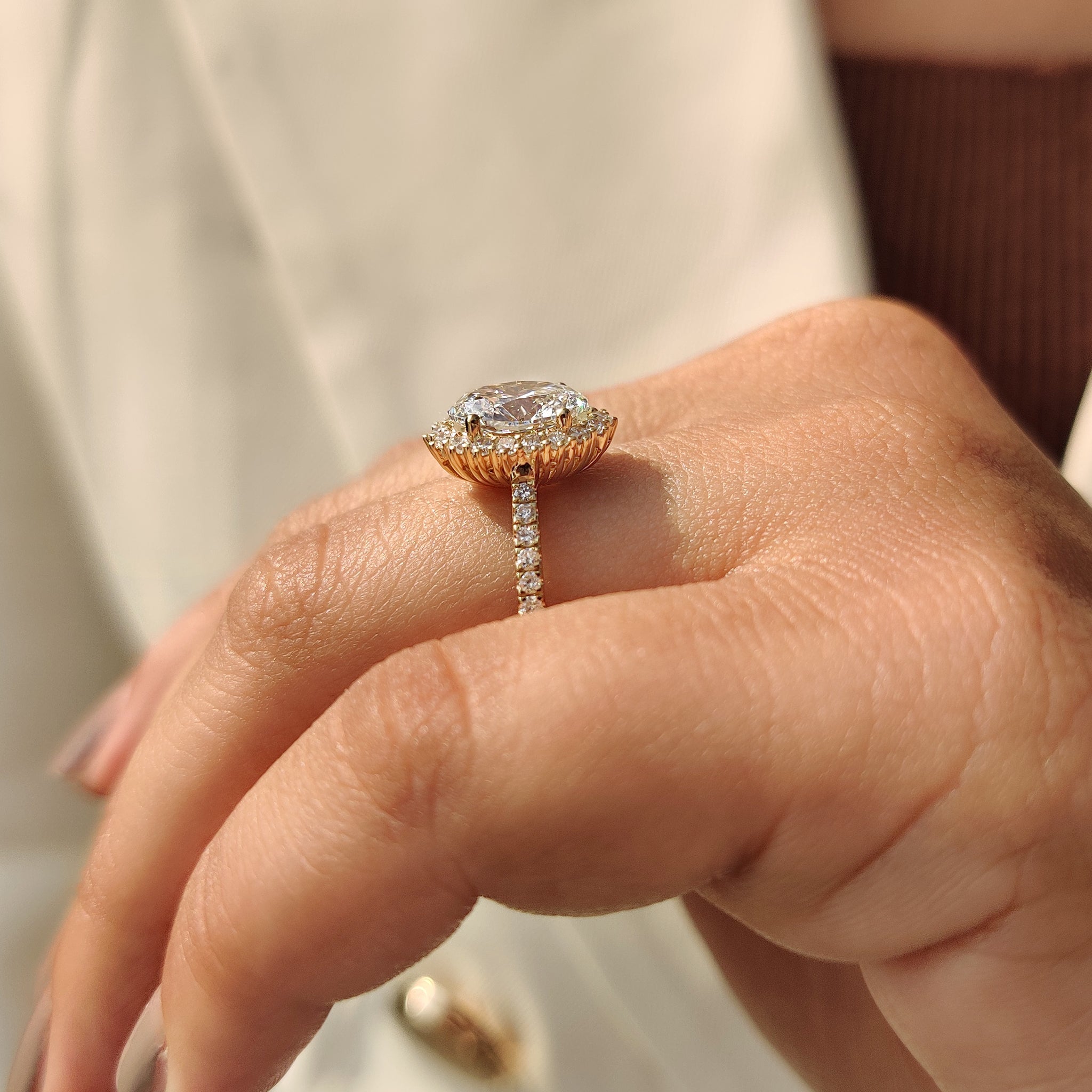 Handmade ring with oval cut diamond halo setting.
