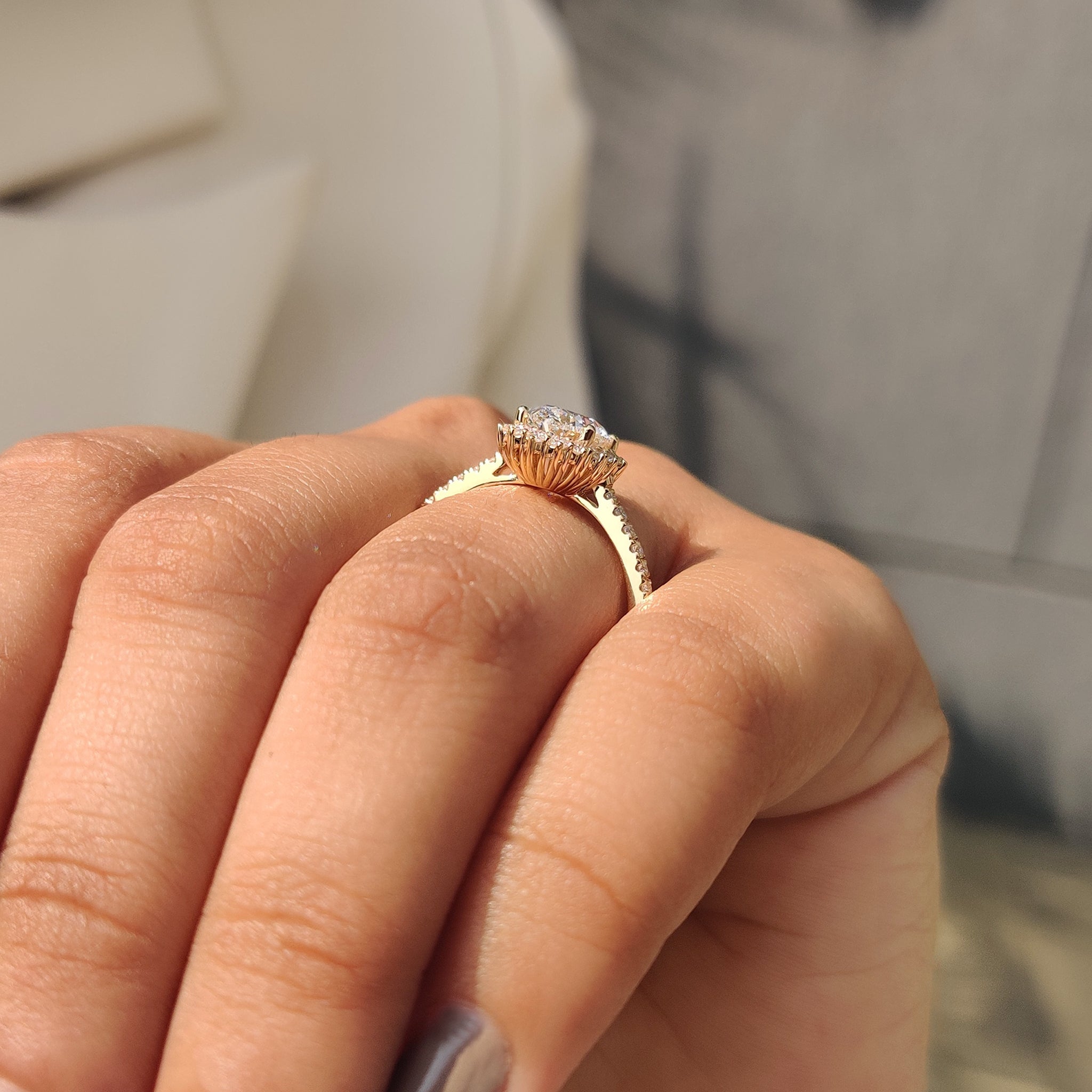 Oval cut diamond ring with halo and pave setting.
