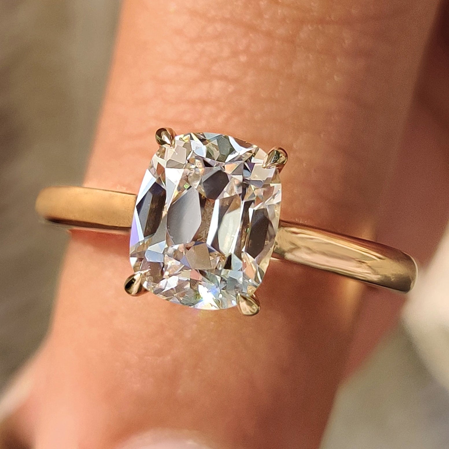 Old european cut diamond ring with solitaire setting and 4 claw prong setting.
