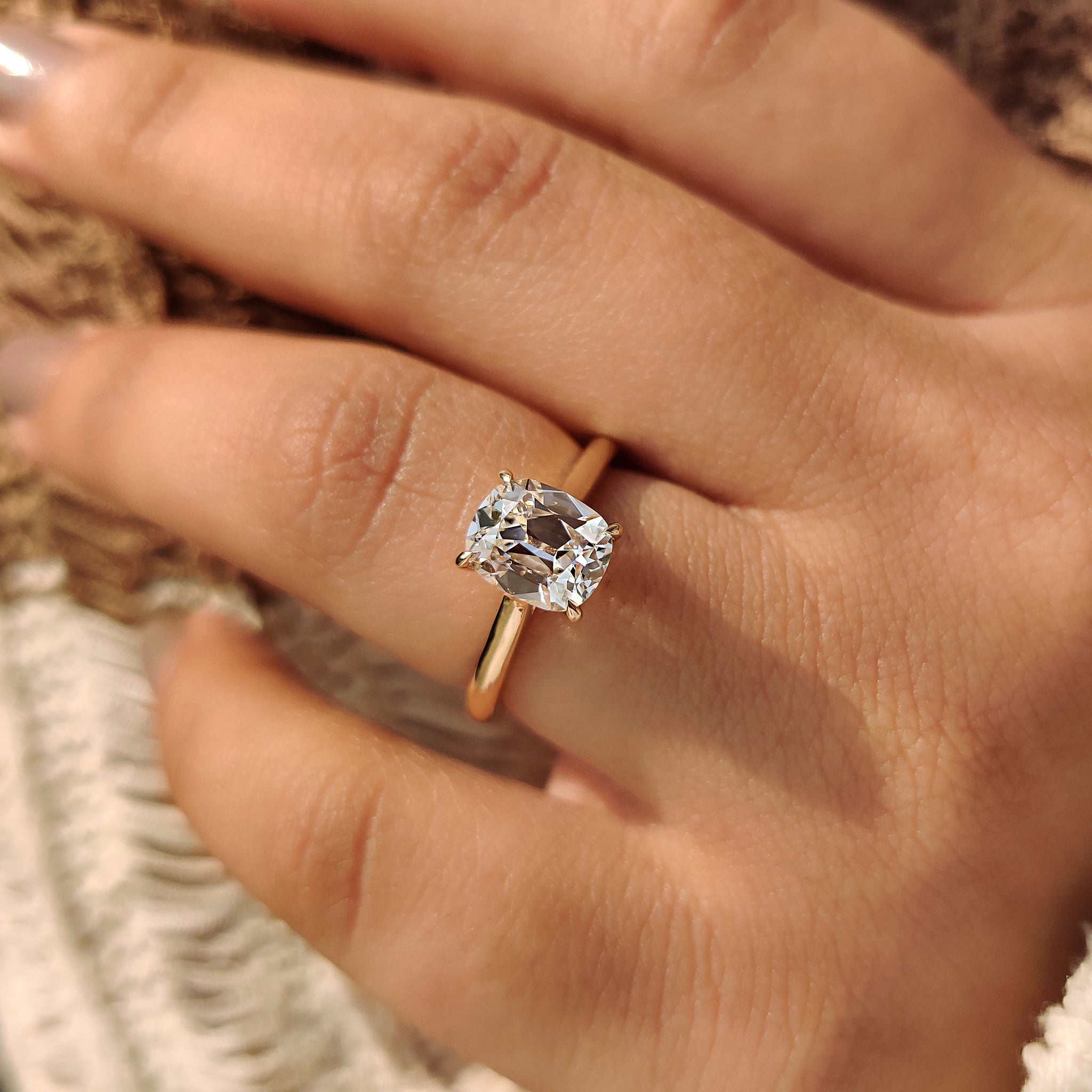 Old european cut diamond ring with cushion oec and 4 claw prong setting.
