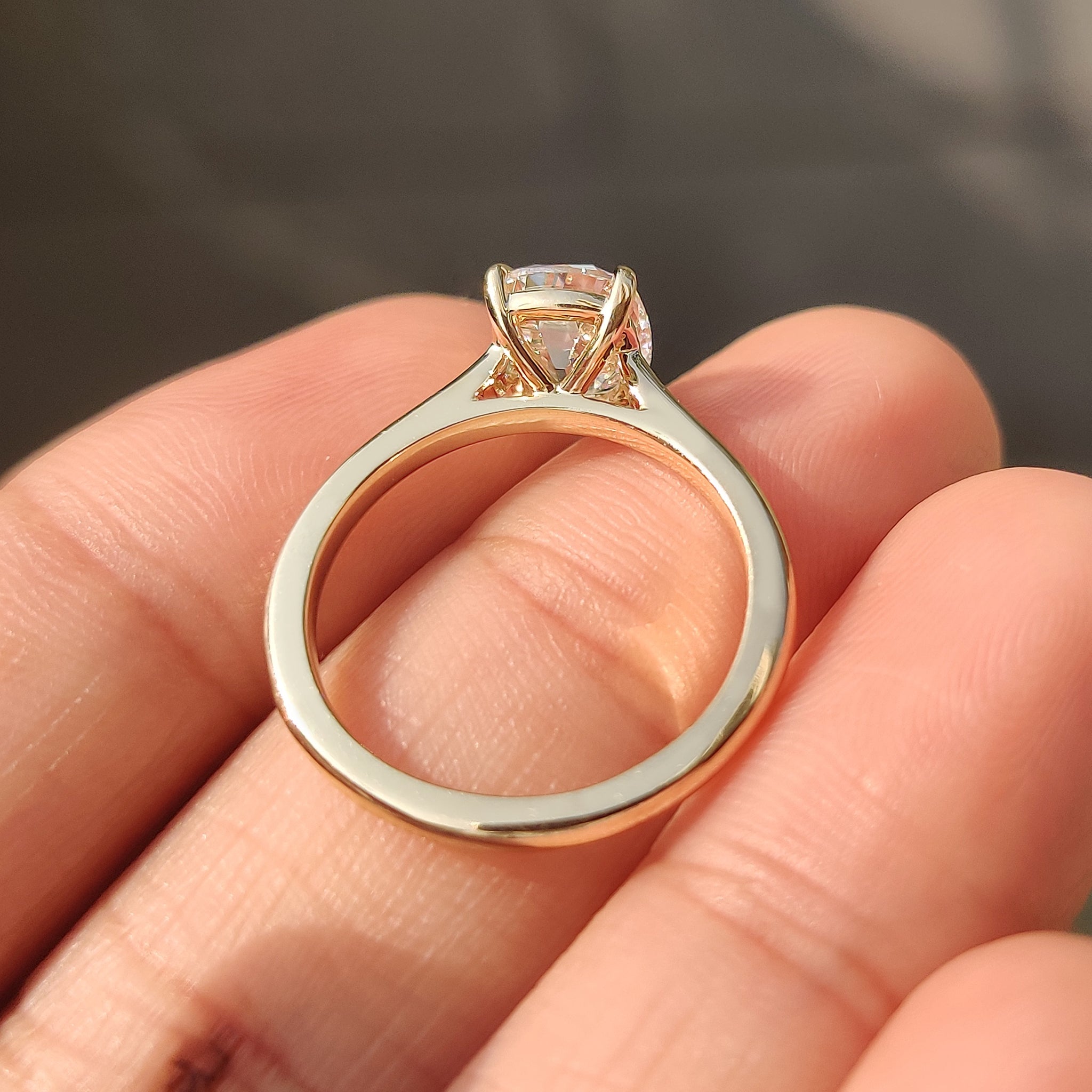 4 claw prong setting on old european cut diamond ring with cathedral setting.

