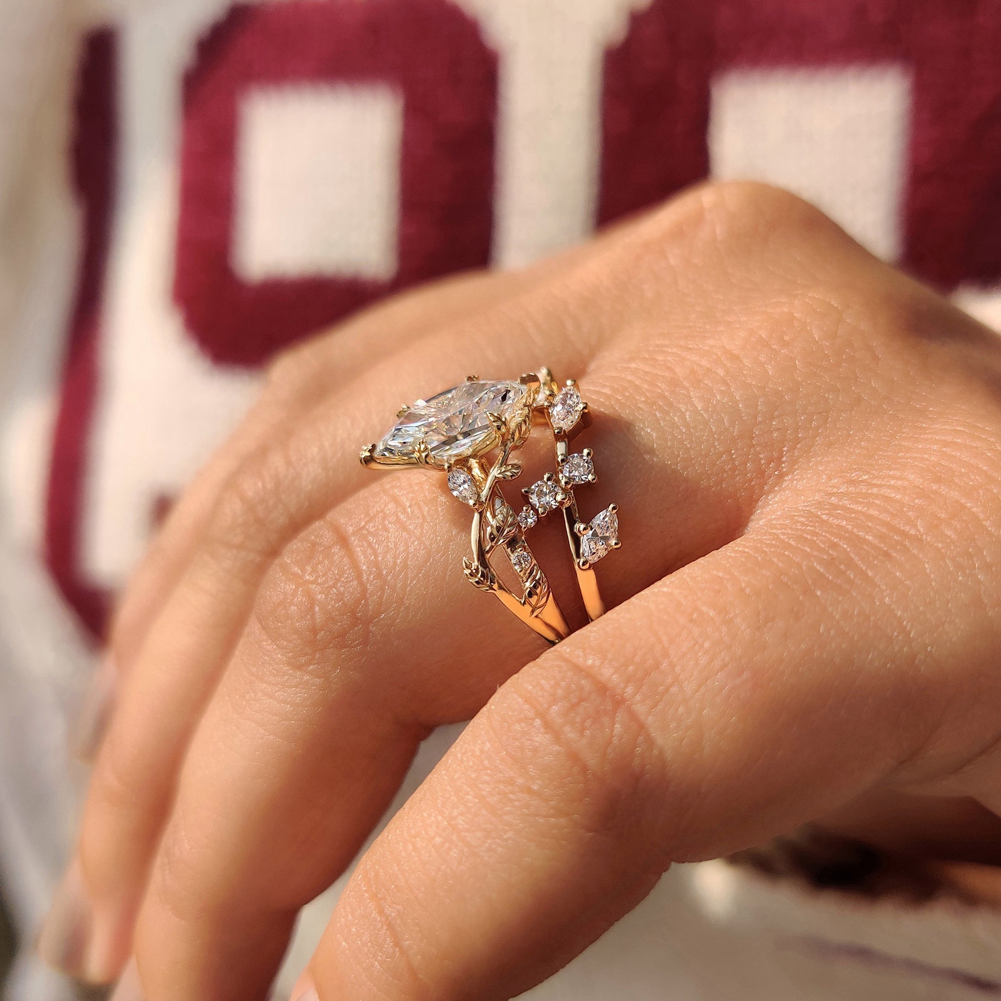Marquise and round diamond wedding band in yellow gold.
