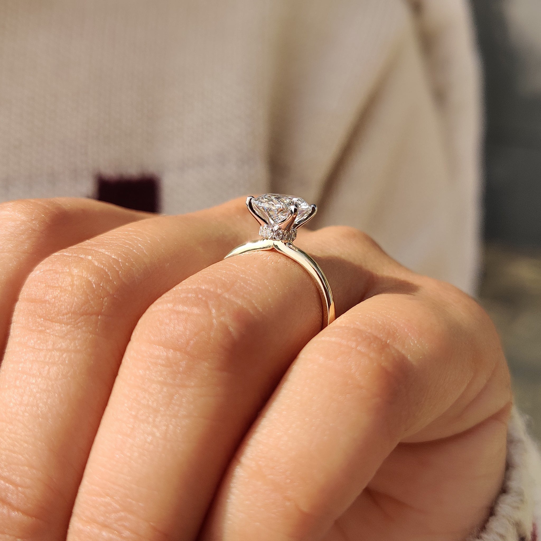 Yellow gold ring with a hidden halo design.
