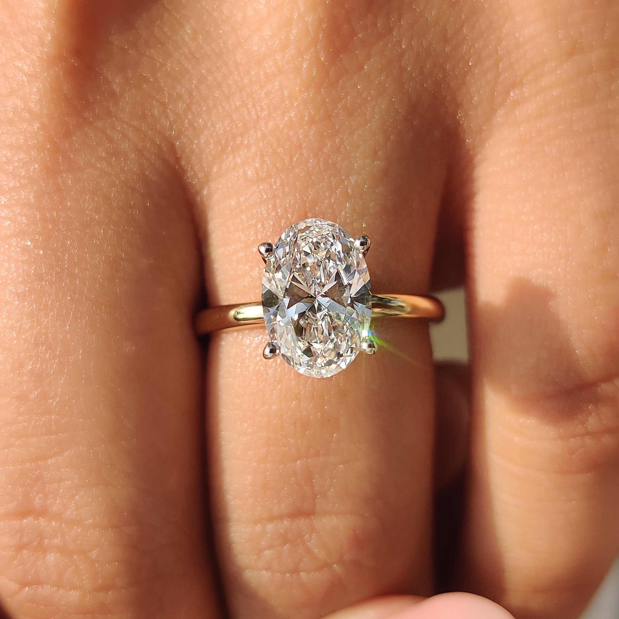 White gold ring with an oval diamond.
