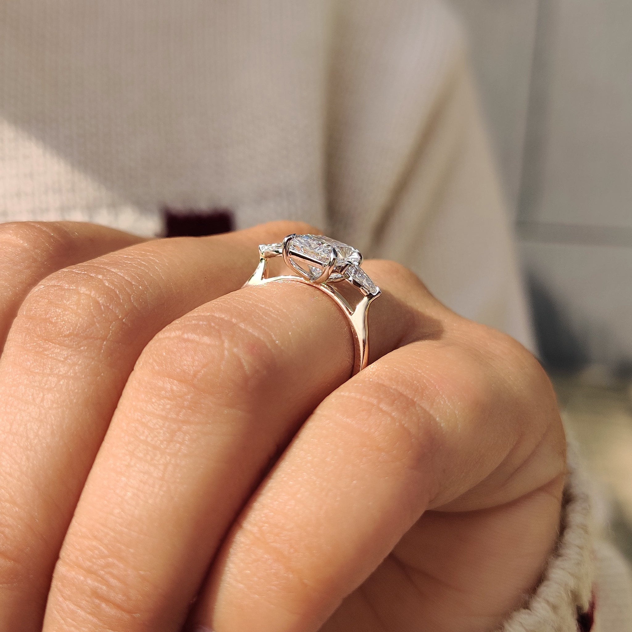 Four claw prong setting radiant cut diamond ring.
