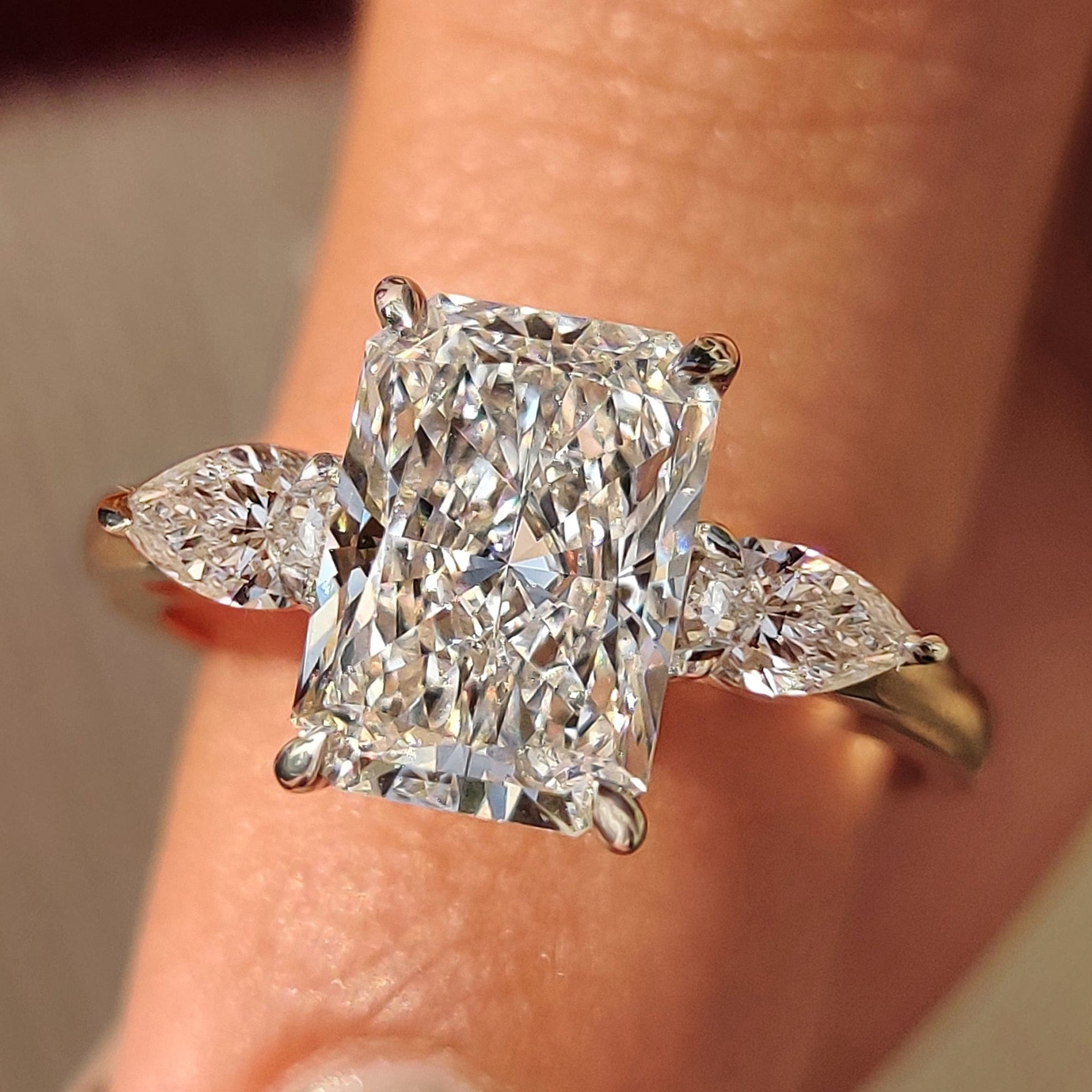 Radiant Cut Diamond Ring With Pear Side Stones