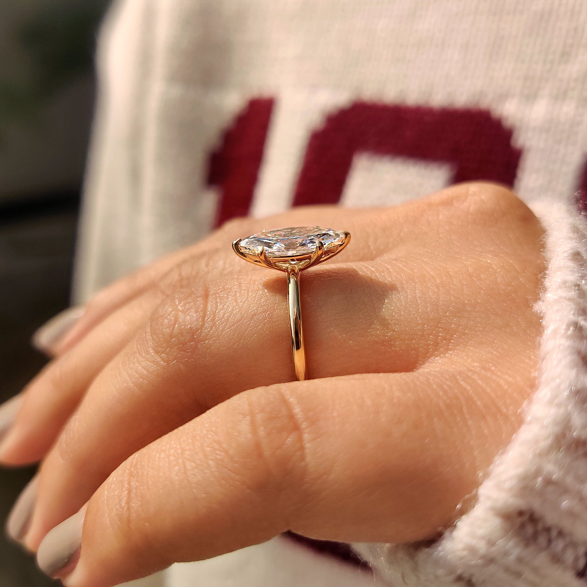 Marquise solitaire diamond engagement ring design.
