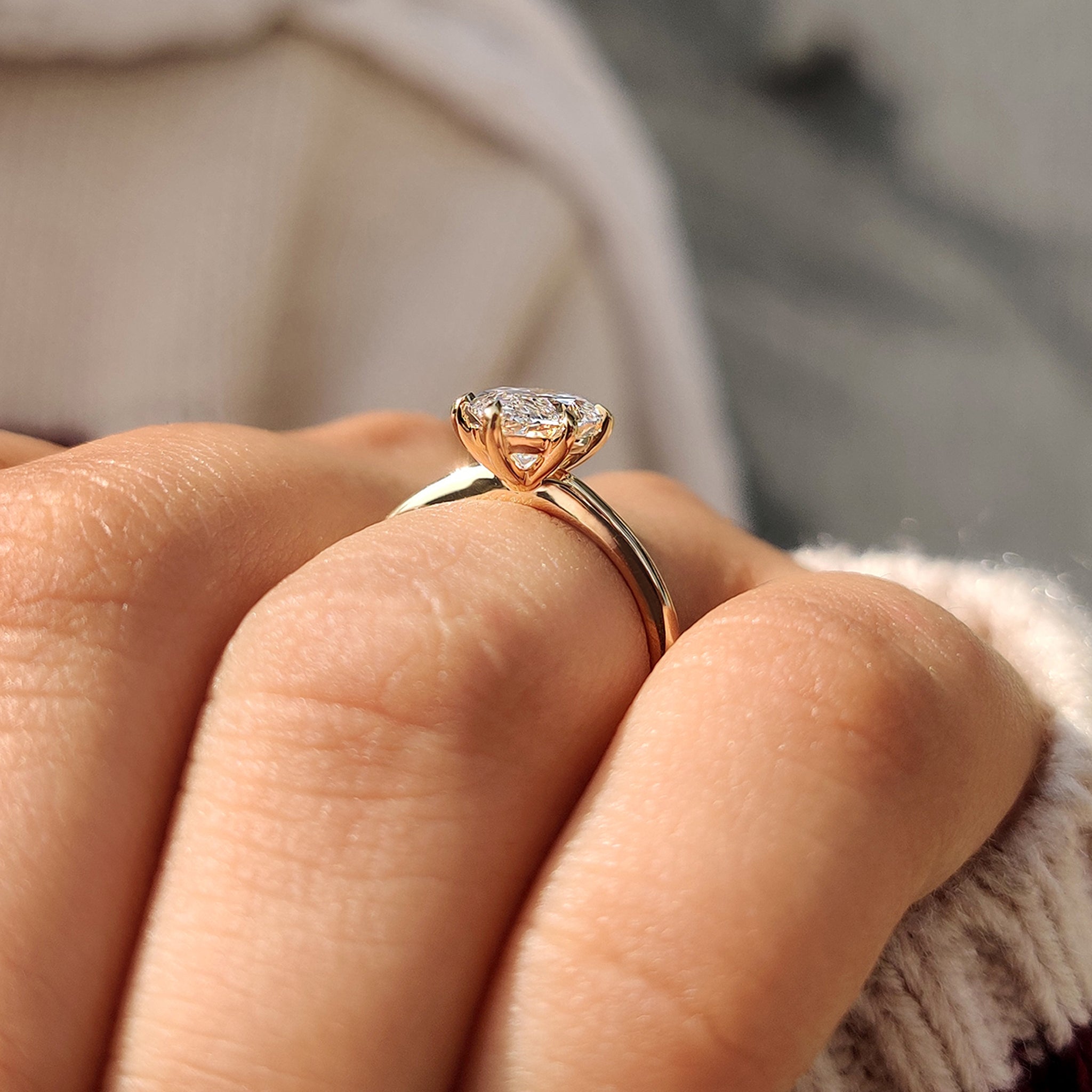 Yellow gold ring with a marquise diamond center.
