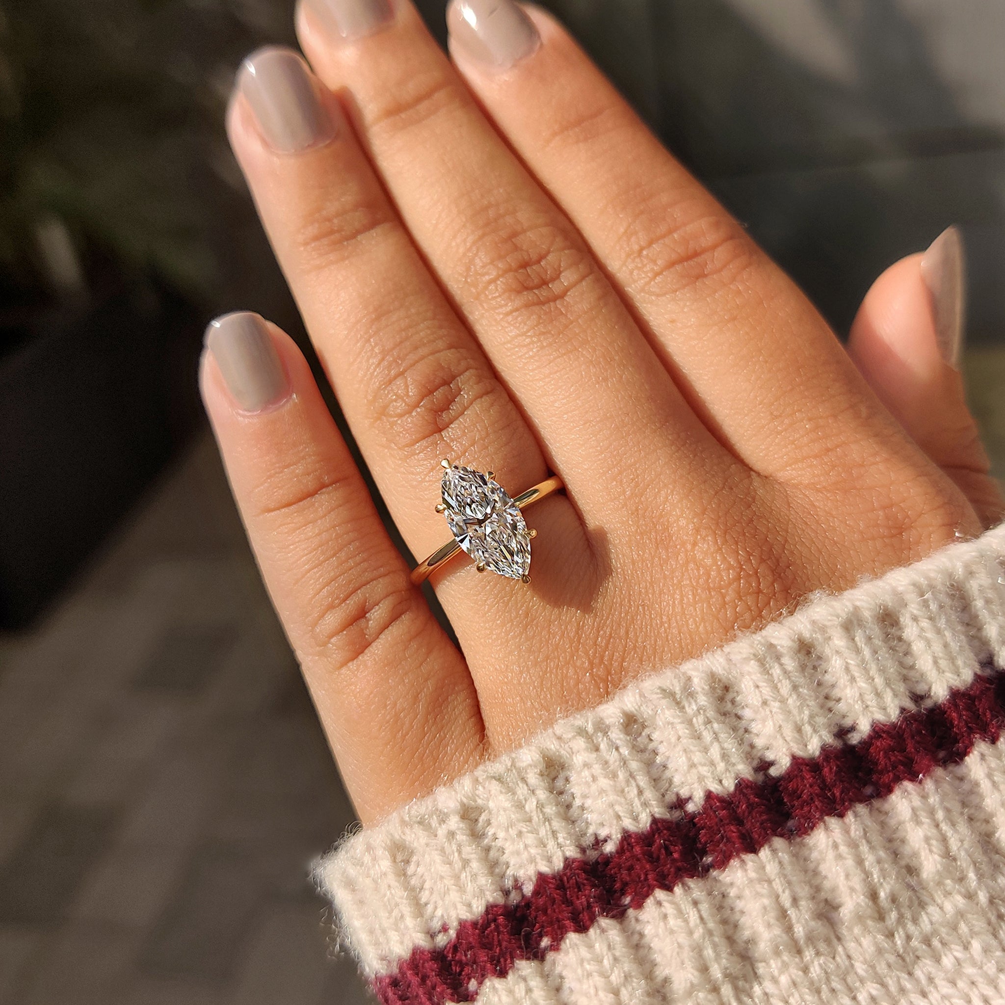 Diamond engagement ring featuring a marquise stone.
