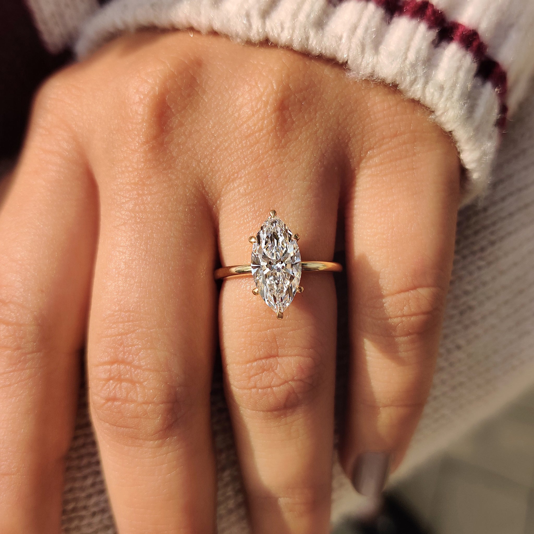 Six claw prong setting marquise diamond ring.

