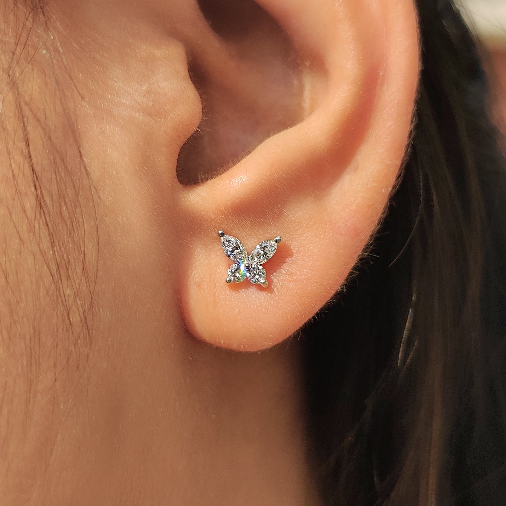 Round diamond earrings in a stud style.
