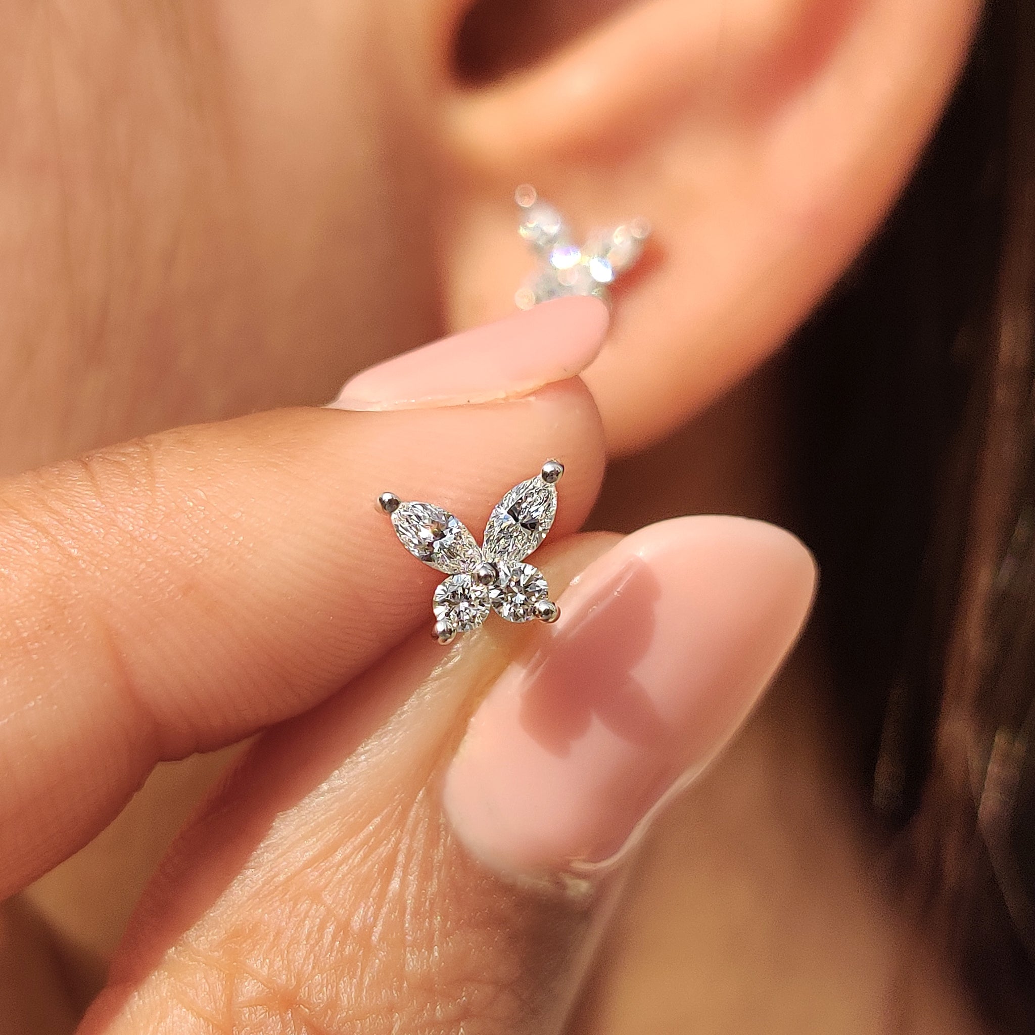 Marquise and round diamond stud earrings.
