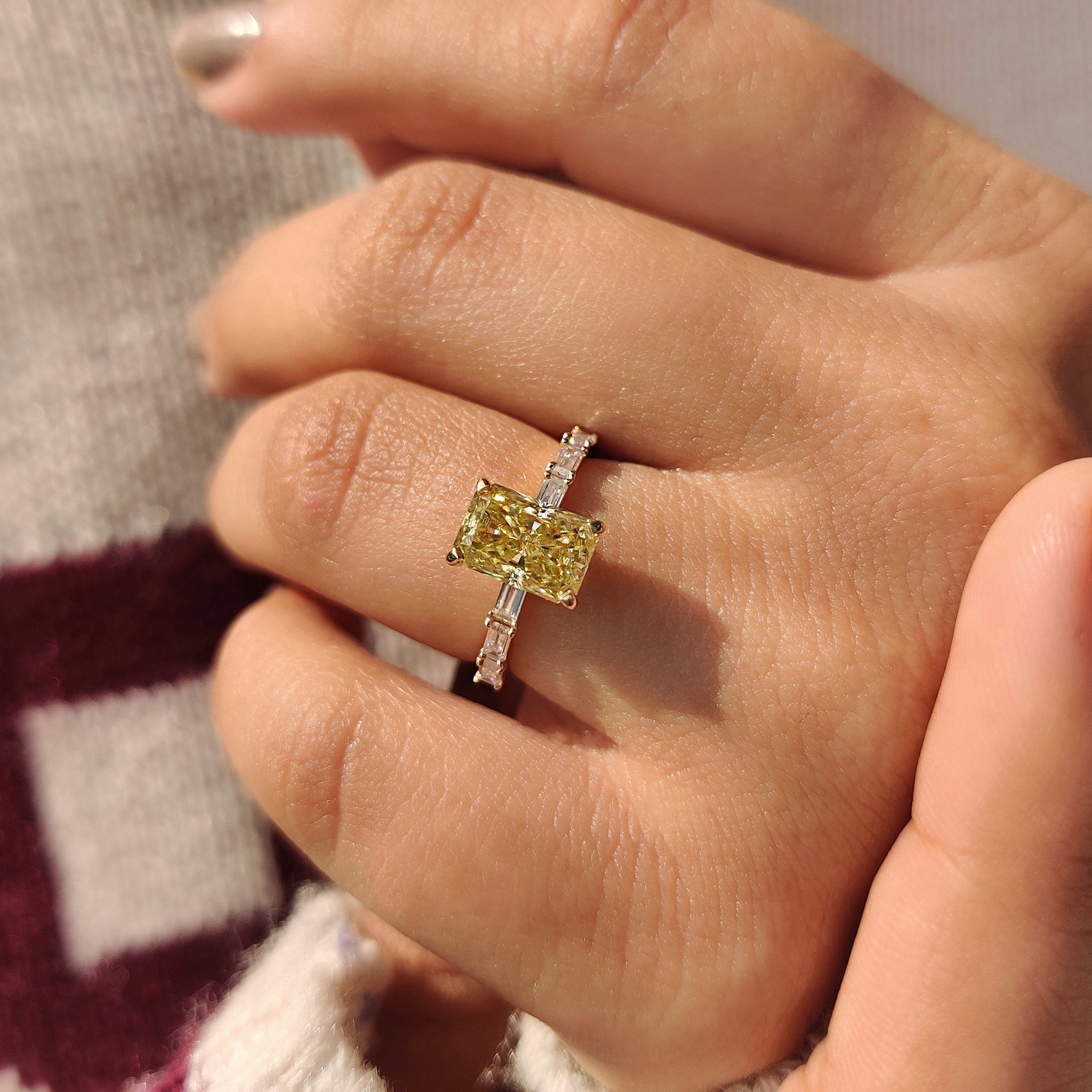 Handmade yellow moissanite ring with radiant cut center stone.
