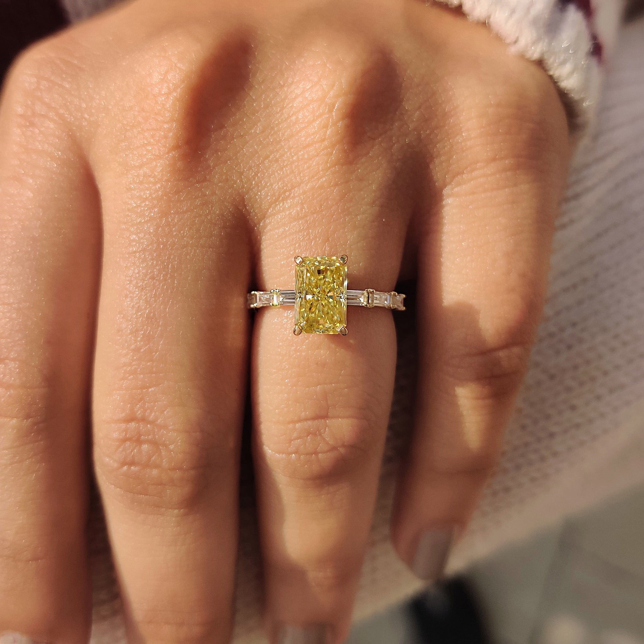 Pave setting ring with radiant cut yellow moissanite center.
