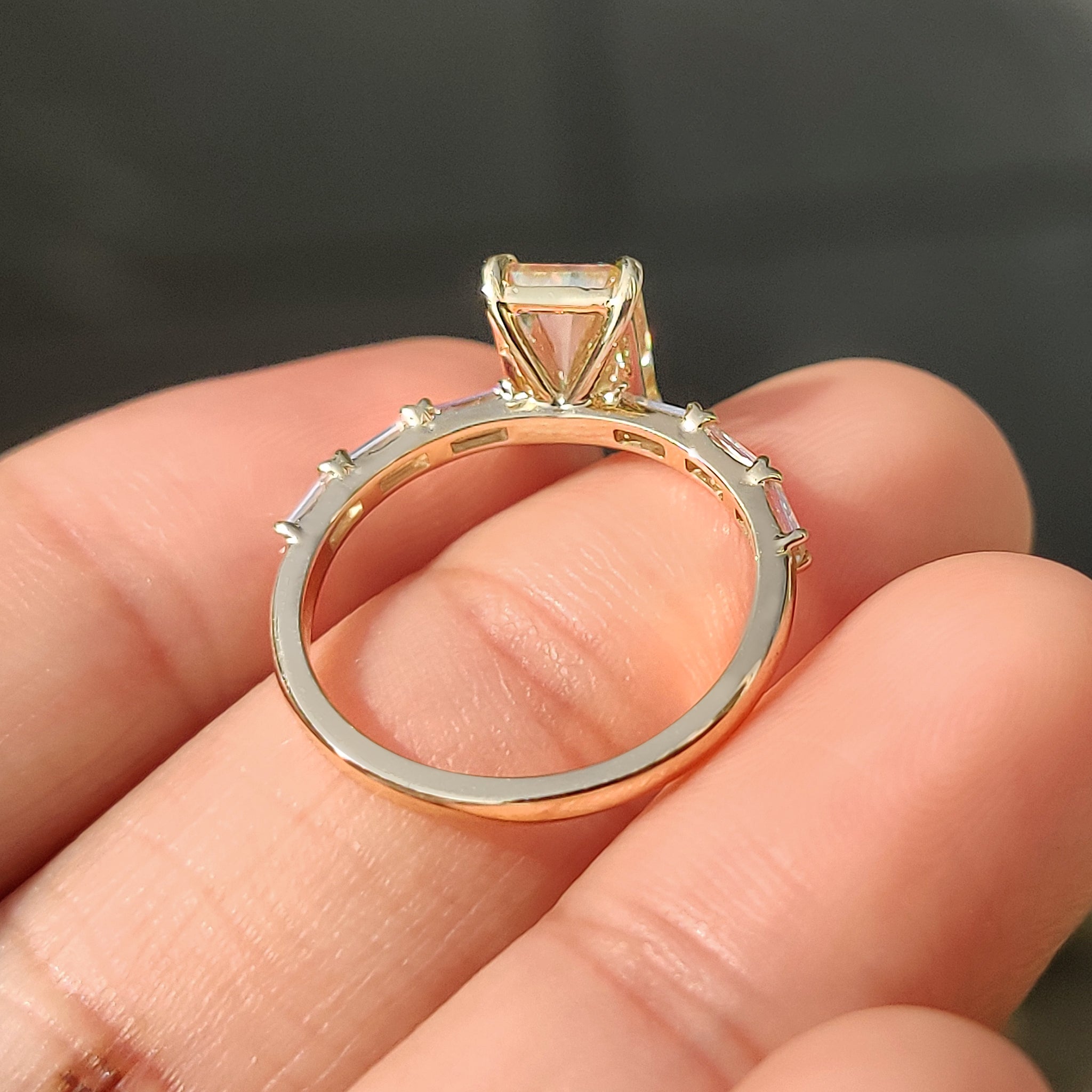Handmade jewelry yellow moissanite ring with four tab prongs.
