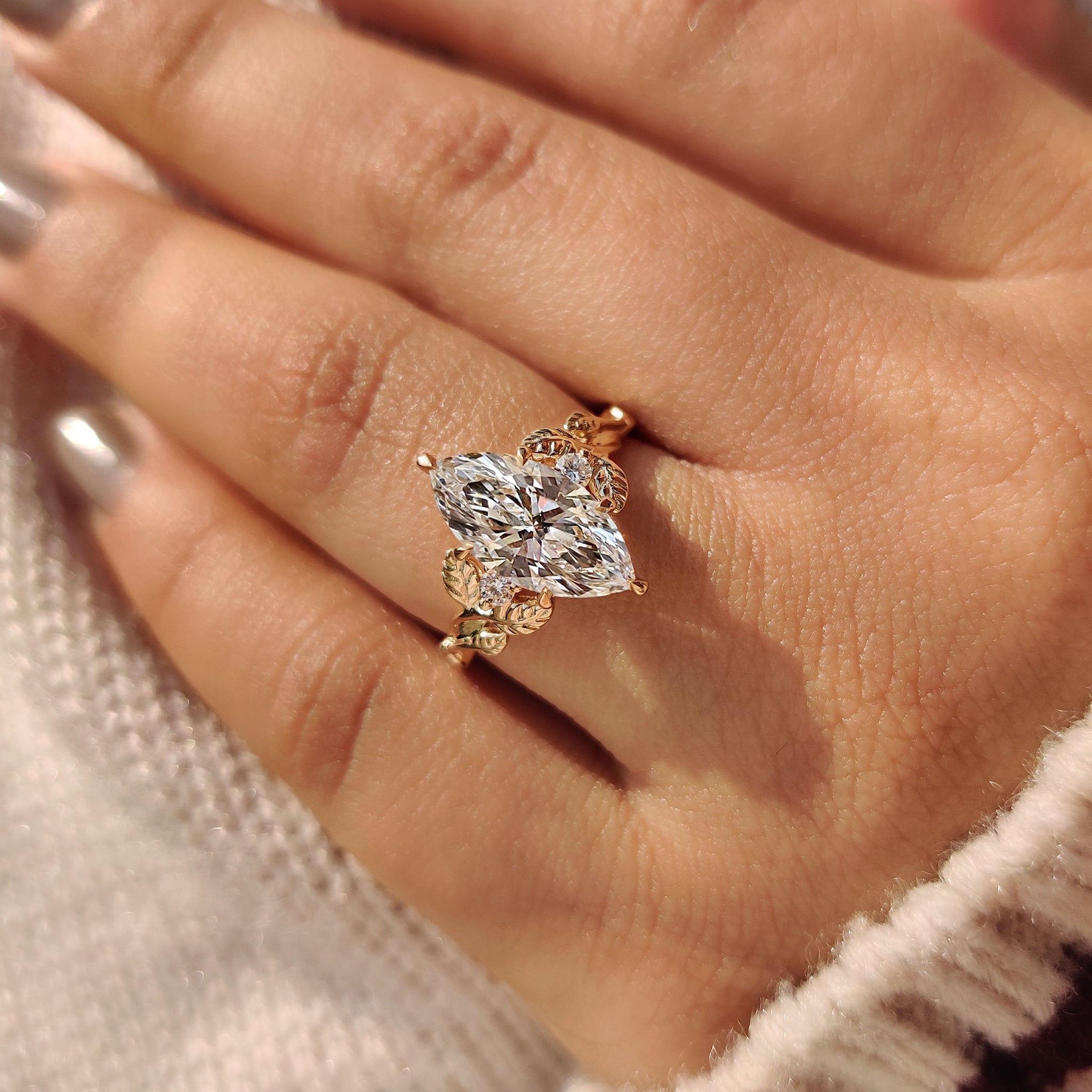 Three Stone Diamond Engagement Ring with Marquise Center.
