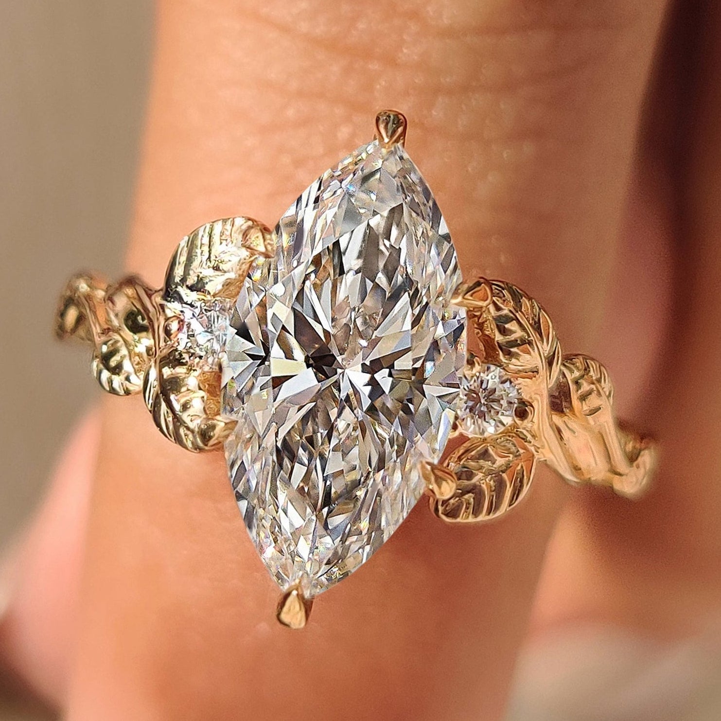 Three Stone Marquise Engagement Ring with Round Side Diamonds.
